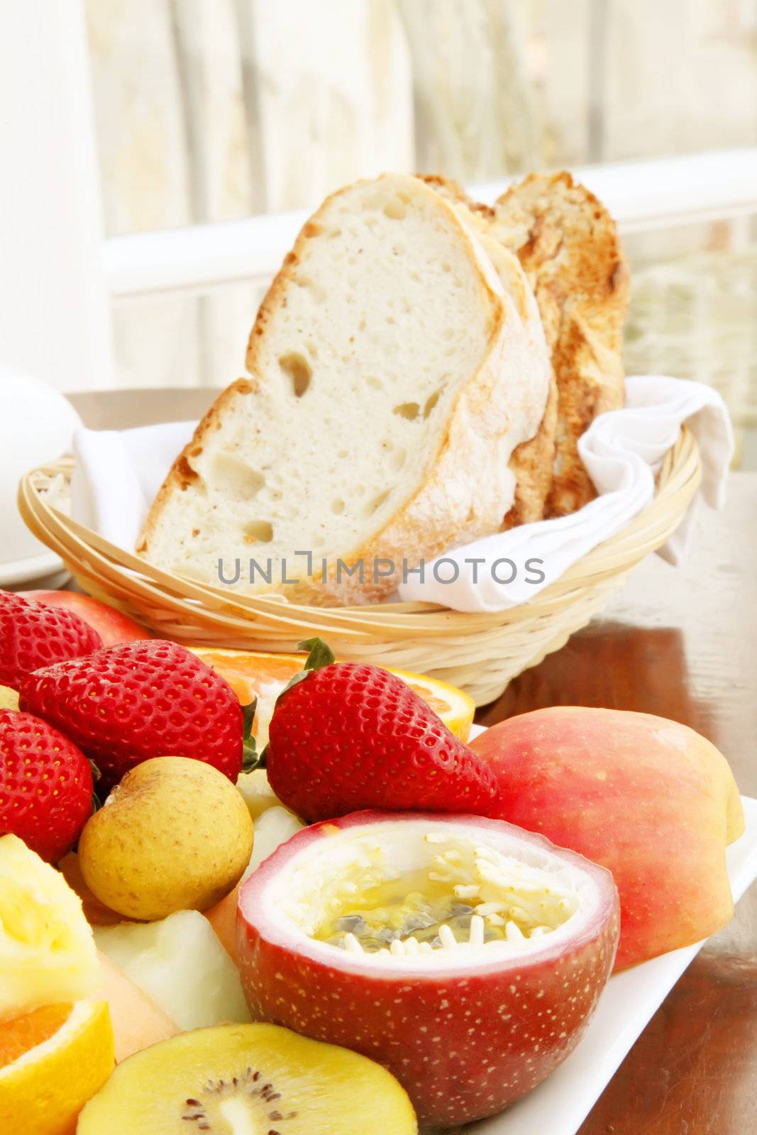 Freshly Baked Bread Cut into Slices with Fruits