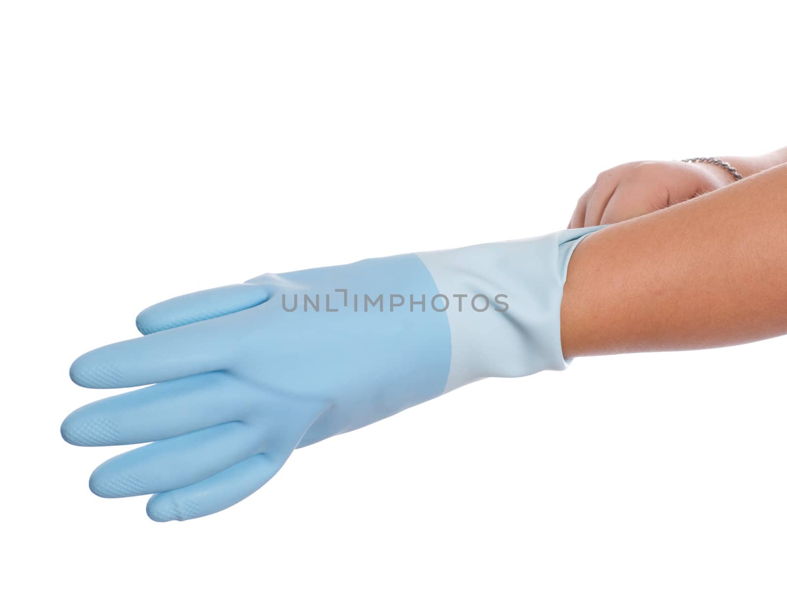 Closeup view of someone putting on a blue rubber glove, isolated against a white background