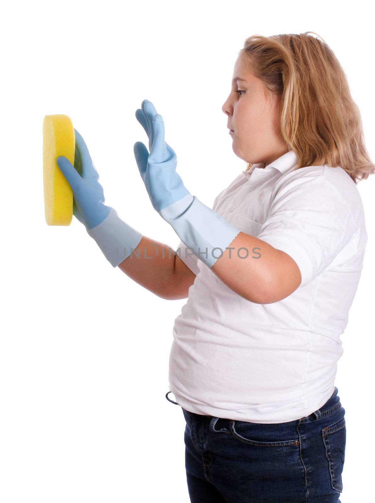 A young girl cleaning something with a yellow sponge, isolated against a white background