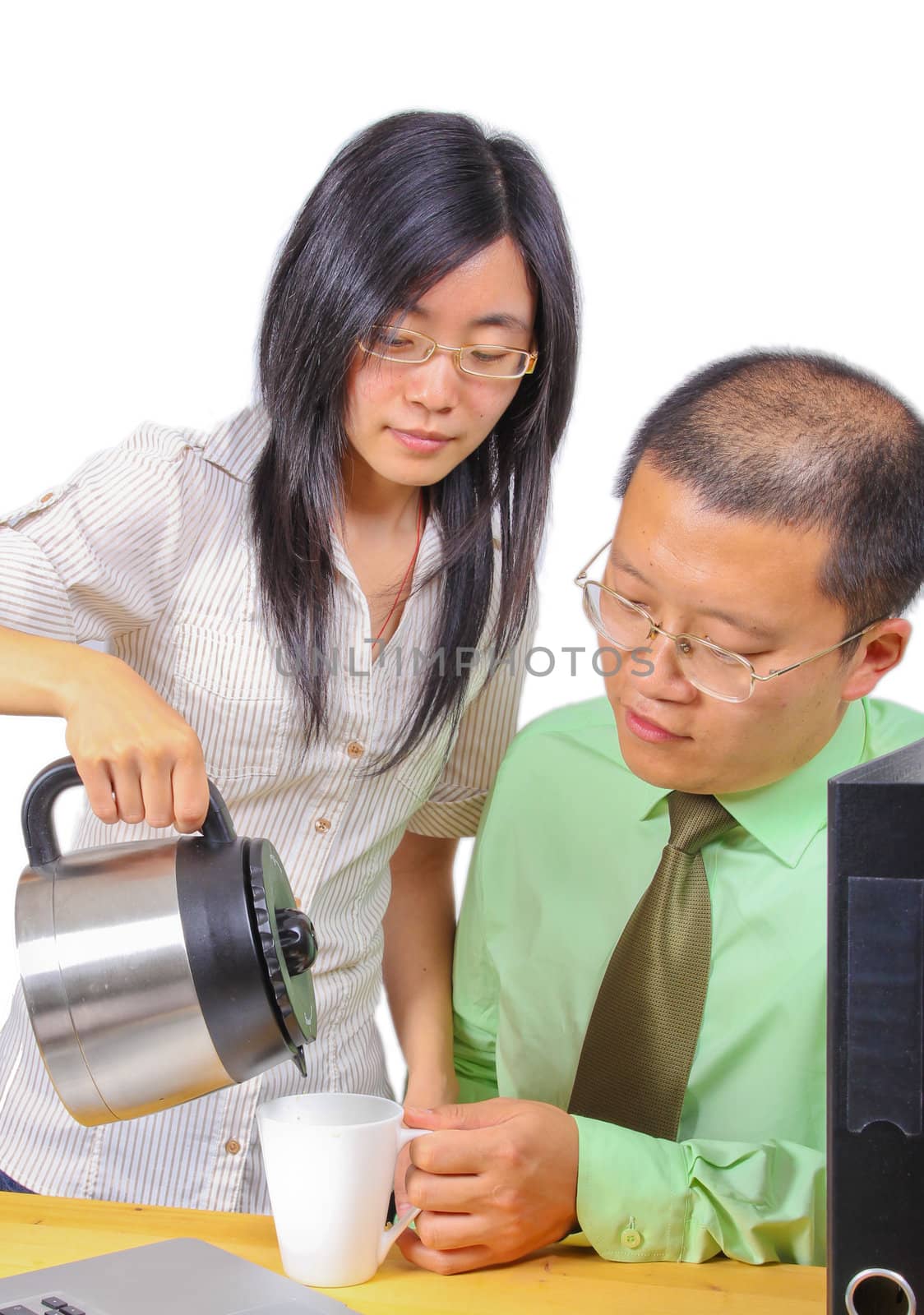 Office worker serving coffee to a coworker