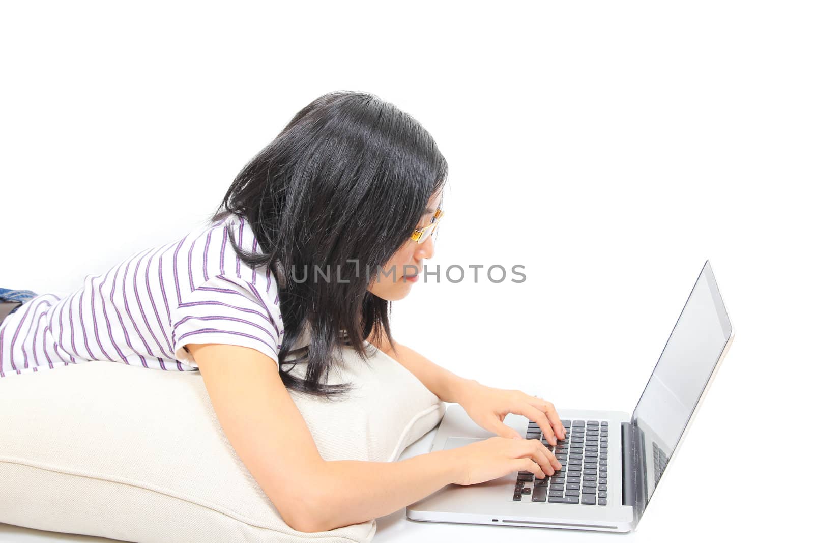 Young chinese woman sitting on the floor with laptop by dotweb