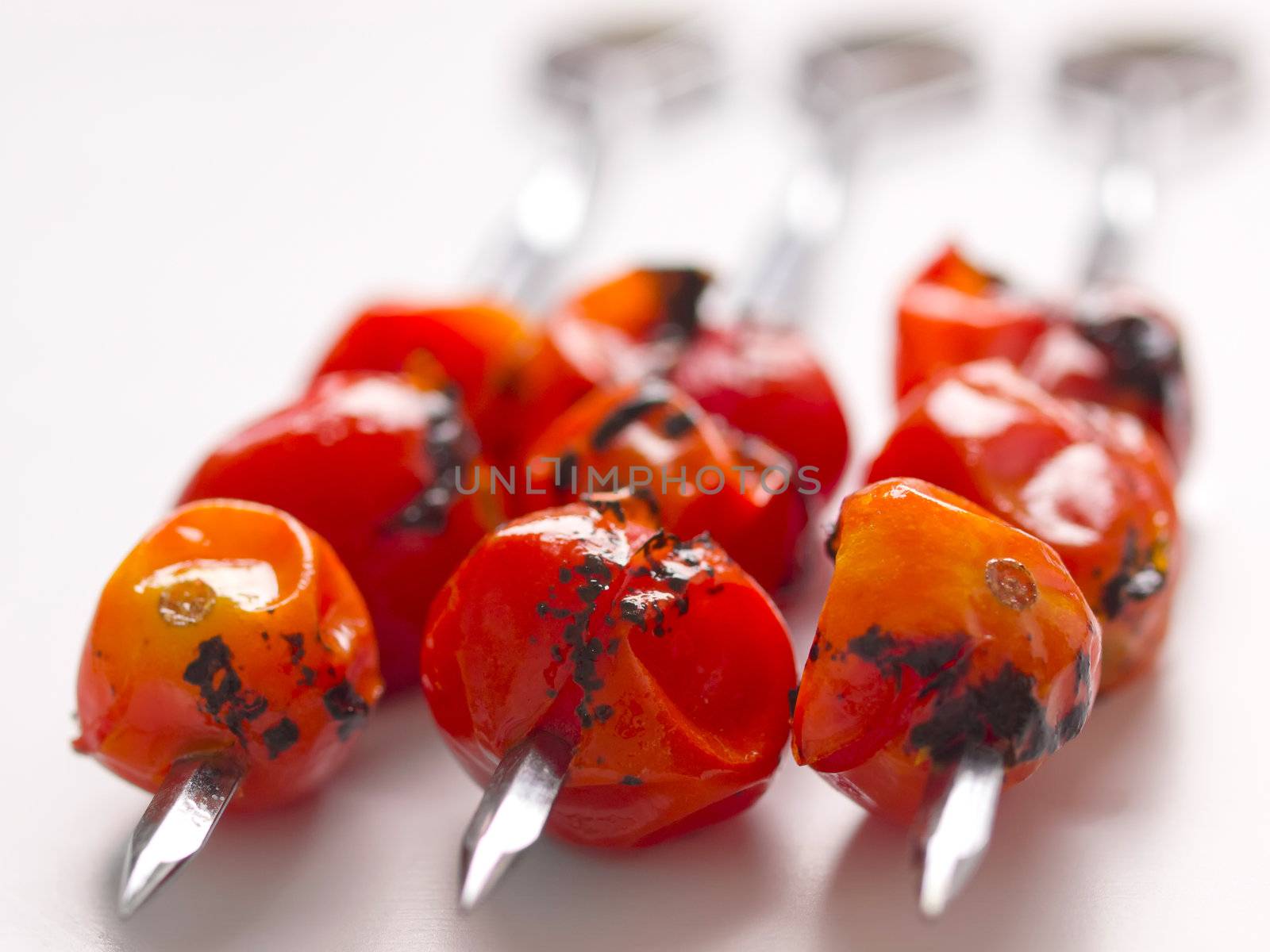 close up of cherry tomato skewers