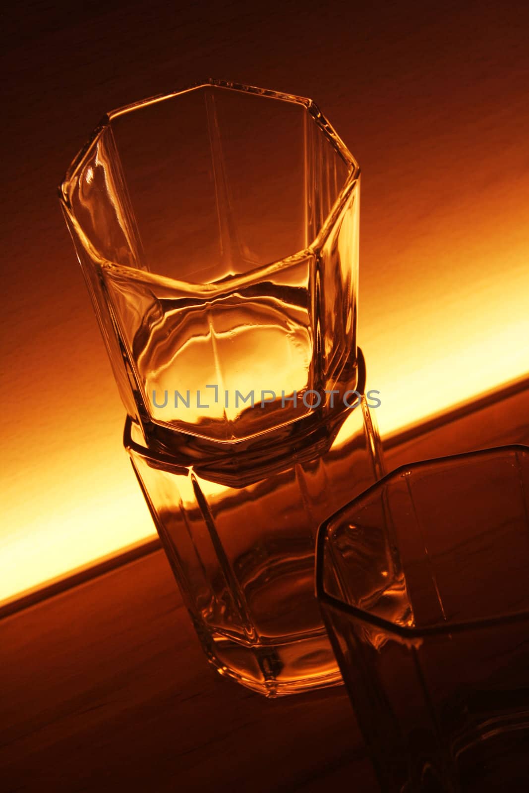 any glasses on a shelf of a pub with light