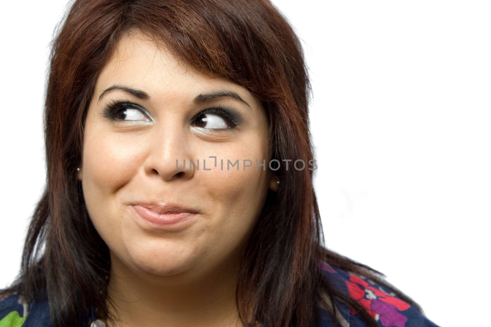 A beautiful young woman isolated over white with a funny mischievous look on her face.