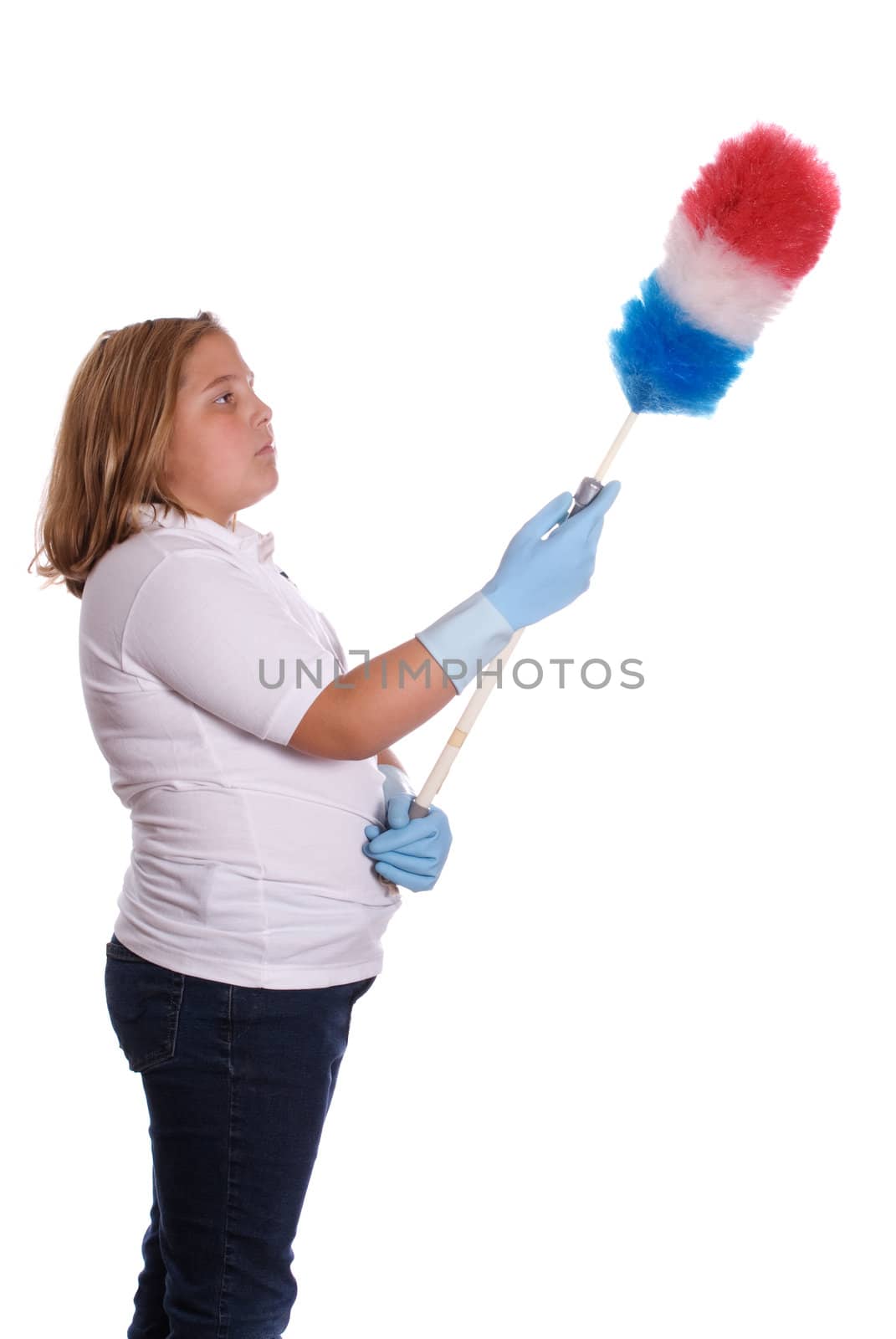 A young girl using a long duster to clean with, isolated against a white background