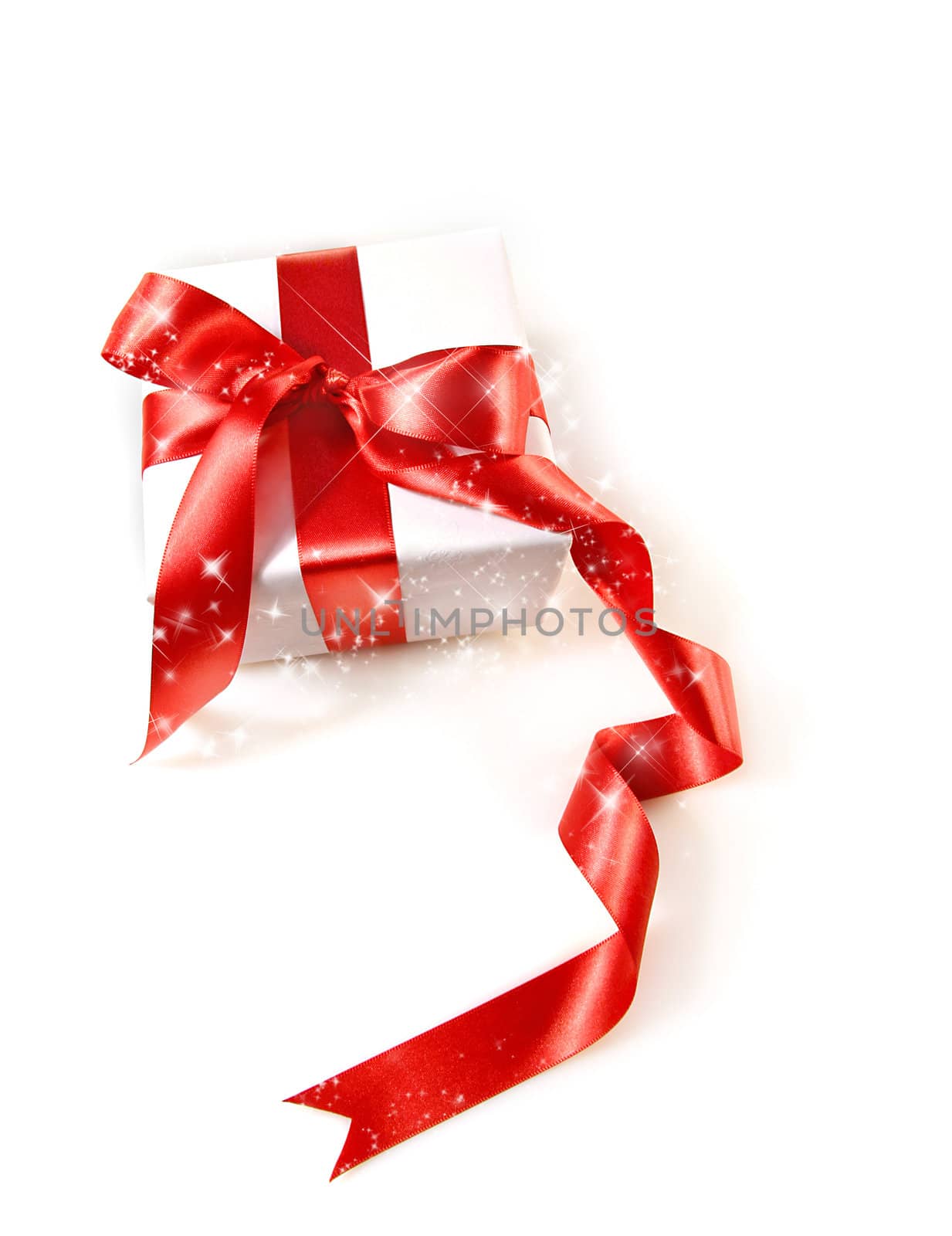 Gift box wrapped with red satin ribbon on white