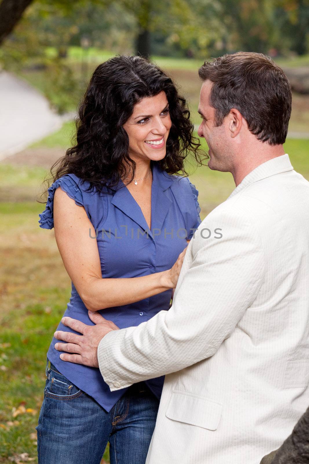 A couple having fun and laughing in the park