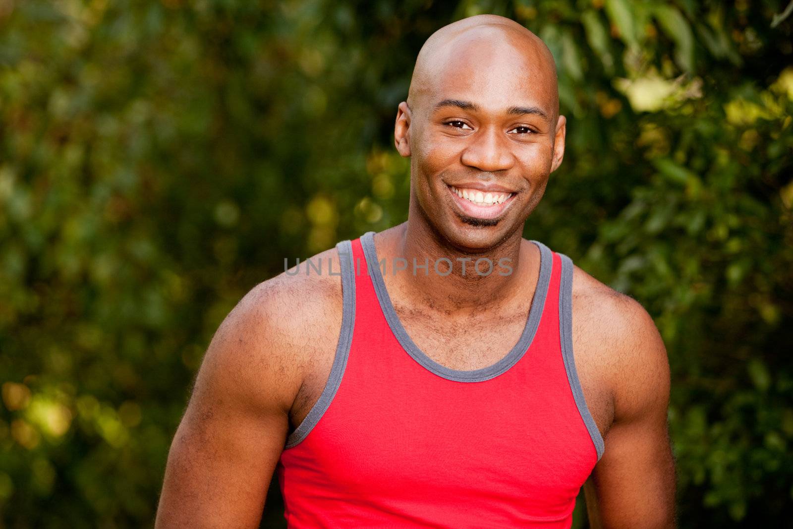 A portrait of an african american man taking a break from exercising