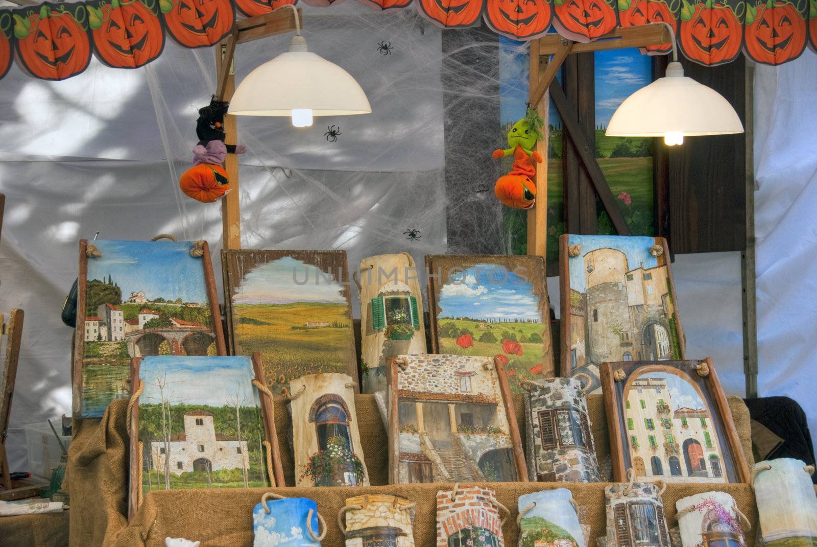 Paintings in a Market, Lucca, Italy by jovannig