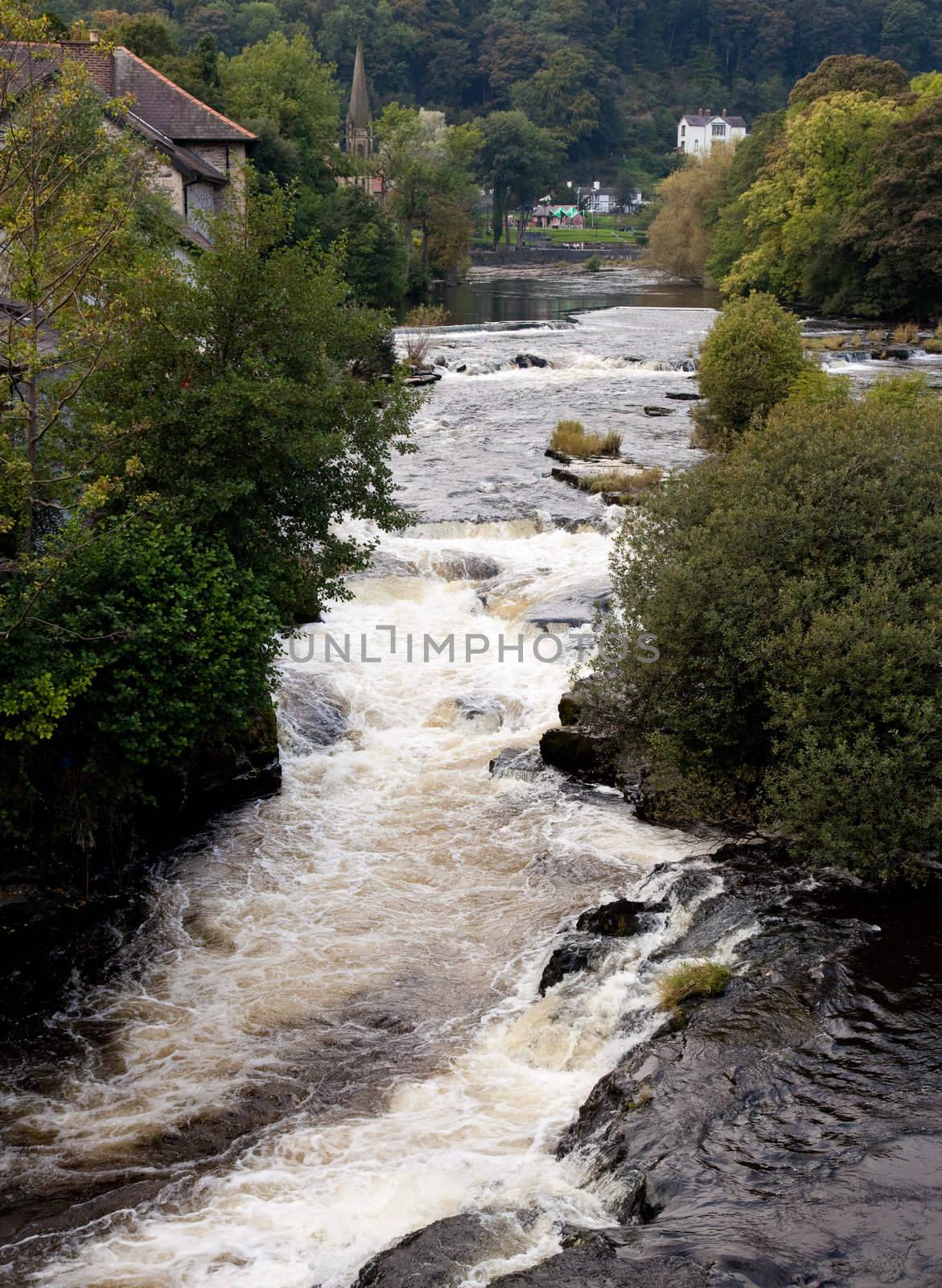 River runs rapidly through Llangollen in Wales by steheap