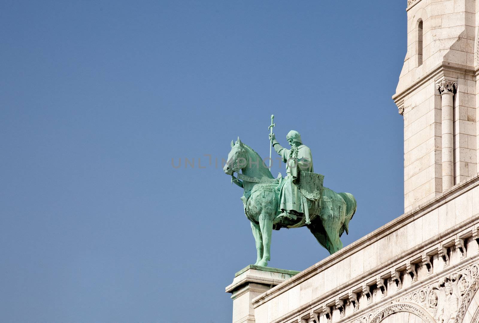 One of the green bronze statues on the edge of Sacre Coeur in Paris