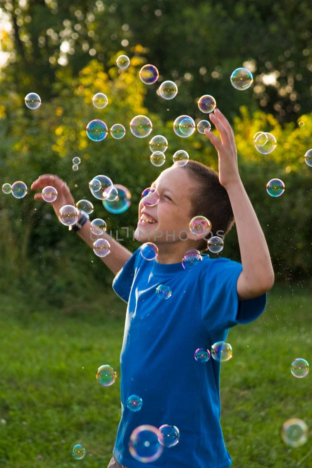 children series: boy play with soap bubbles, childhood