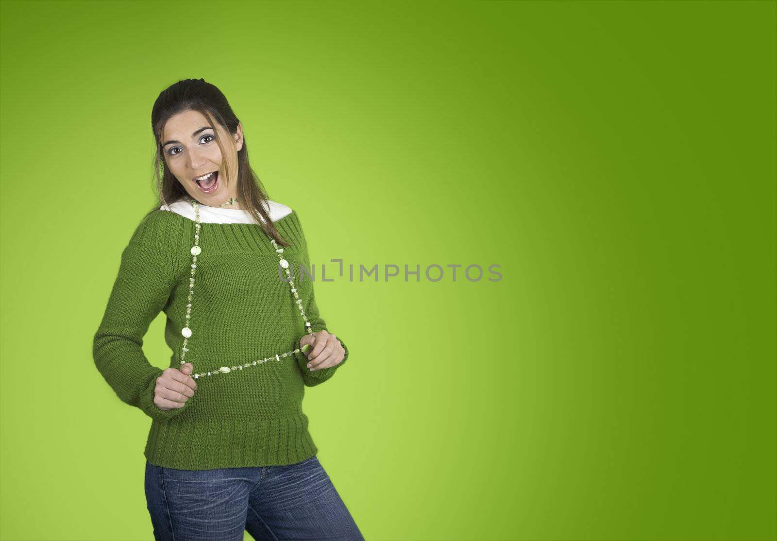 Happy beautiful model on a green background