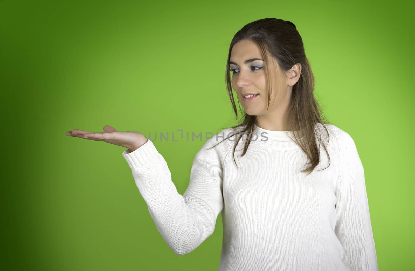 Beautiful young woman showing something on her hand ( the designer can put any object on her hand)