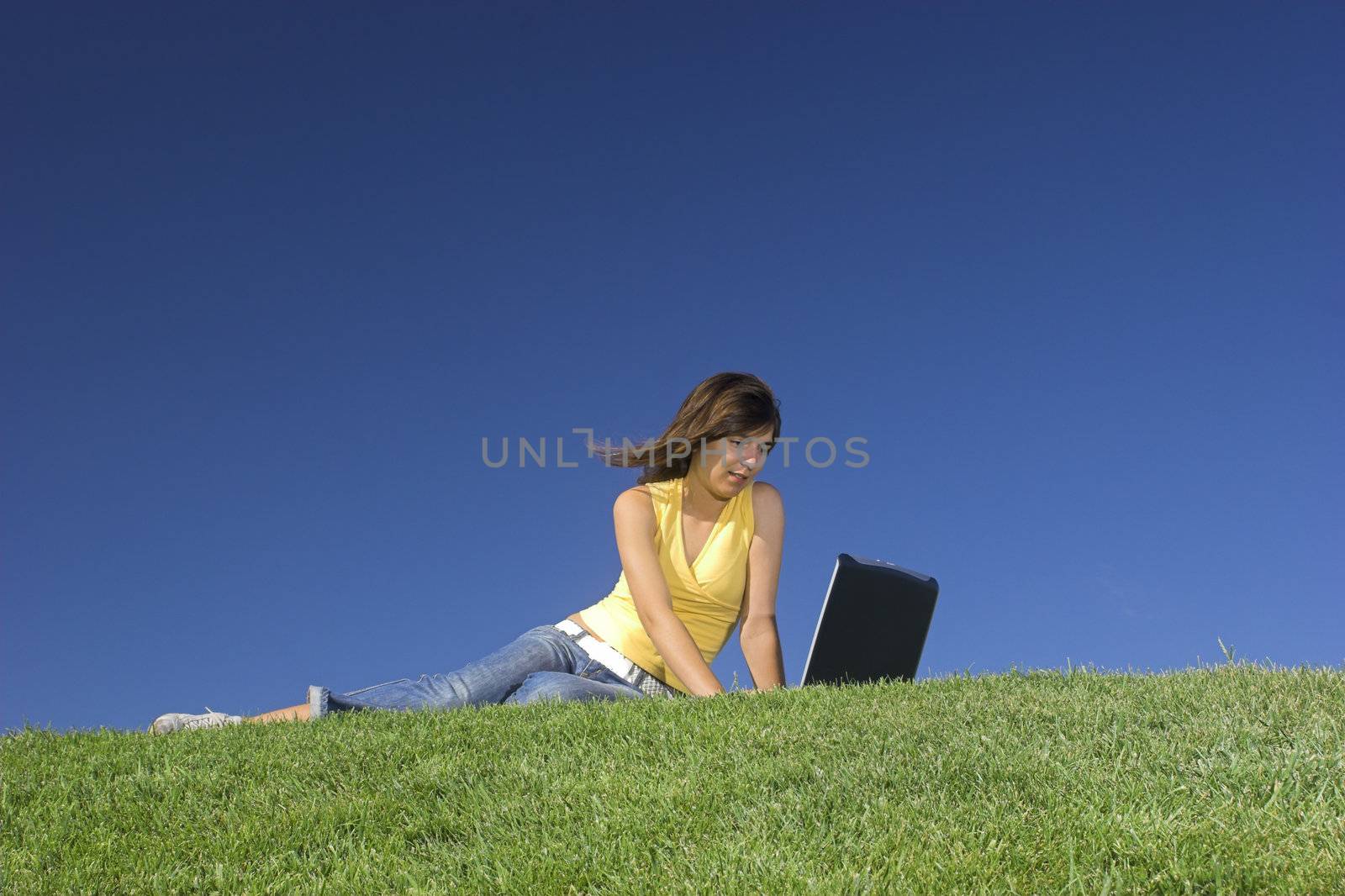 Woman in outdoor study with a laptop