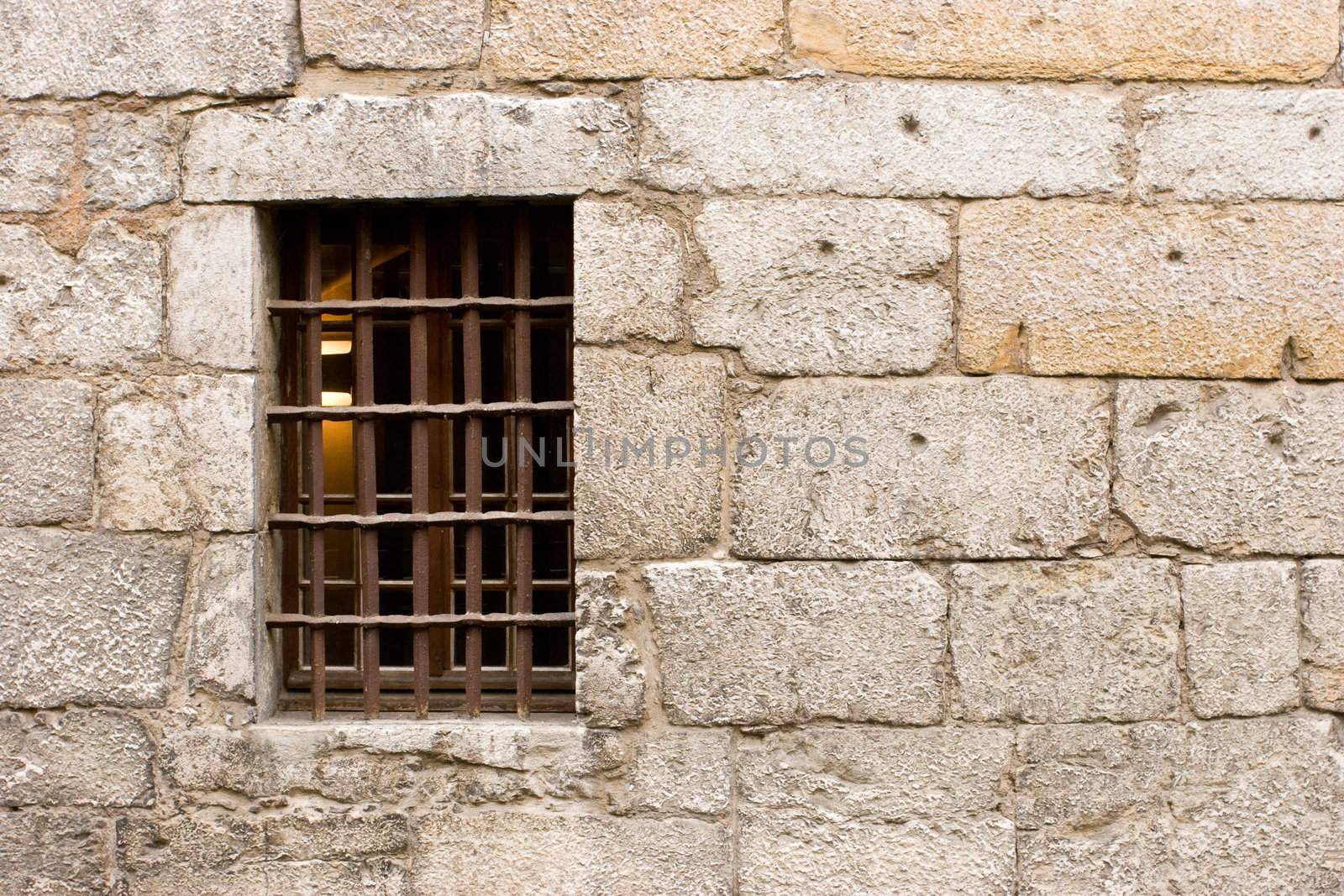 Antique wall with grated window at Annecy, France