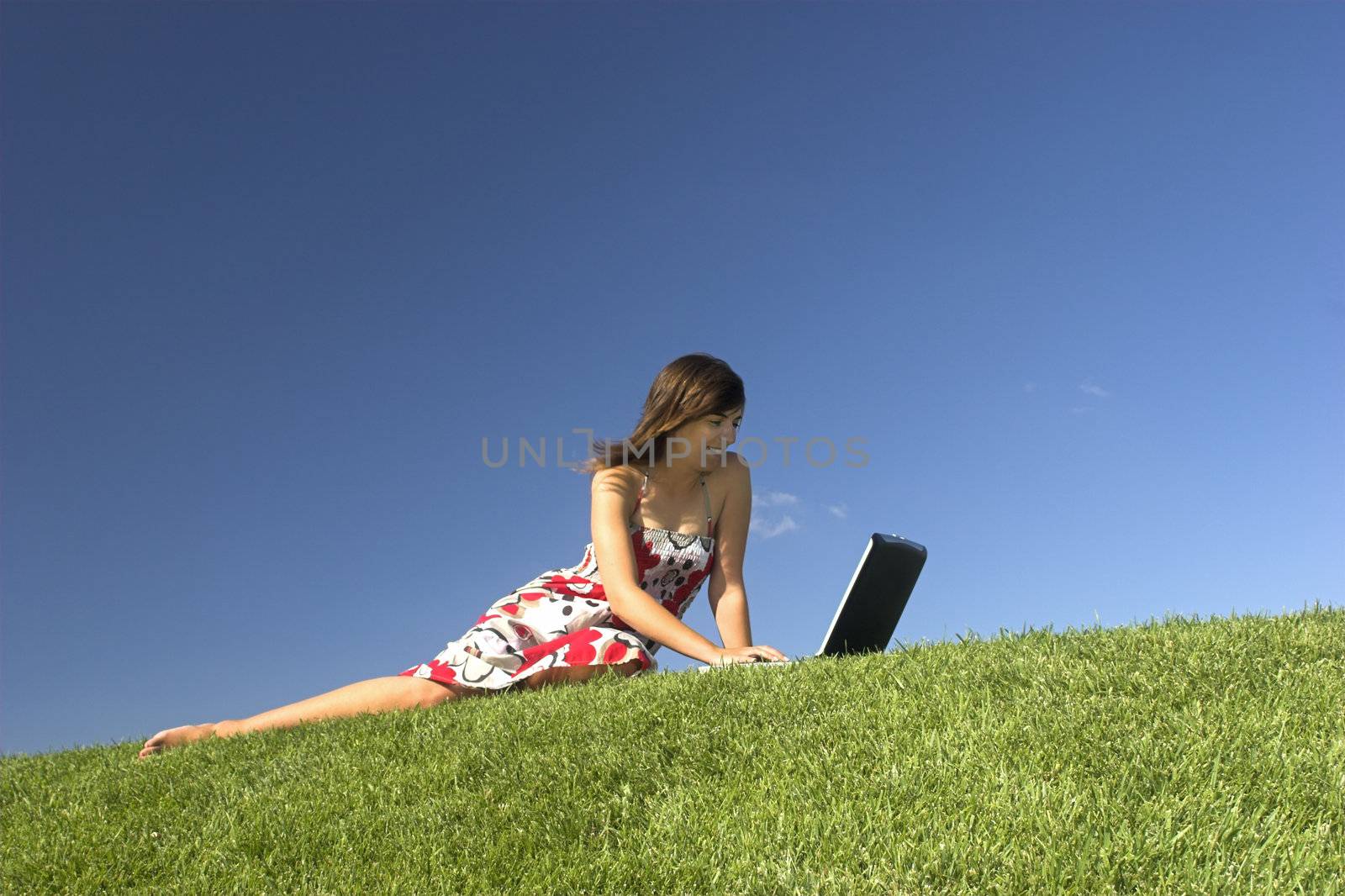 Woman in outdoor study with a laptop