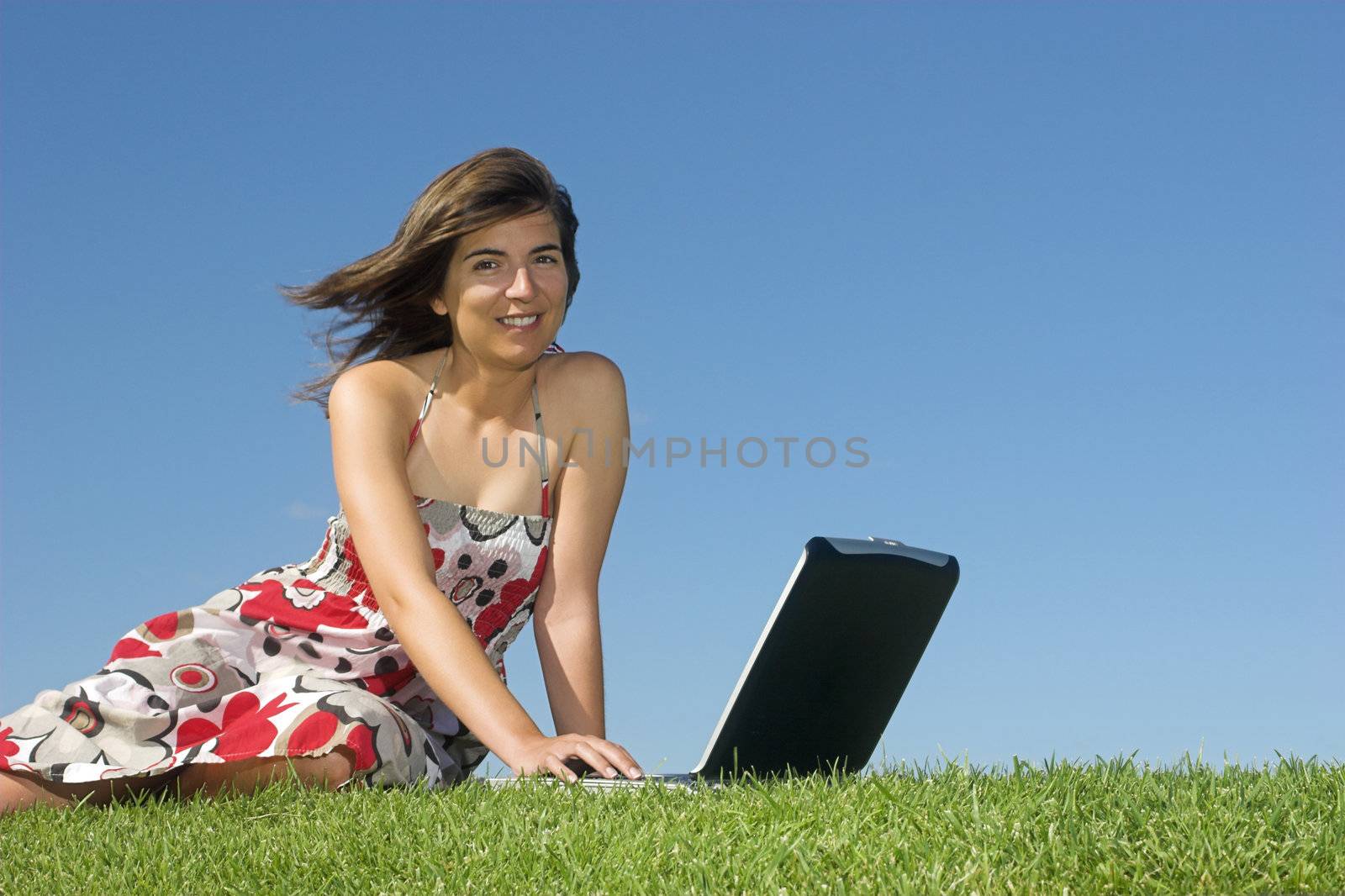 Woman in outdoor study with a laptop