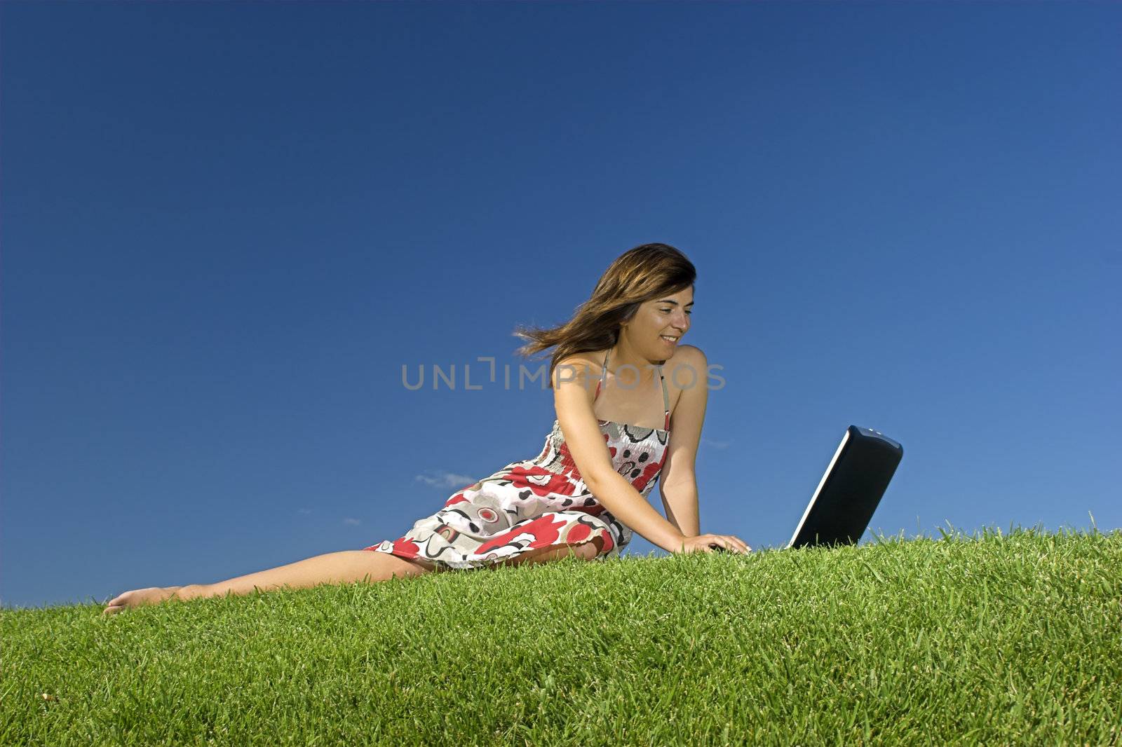 Woman in outdoor study with a laptop