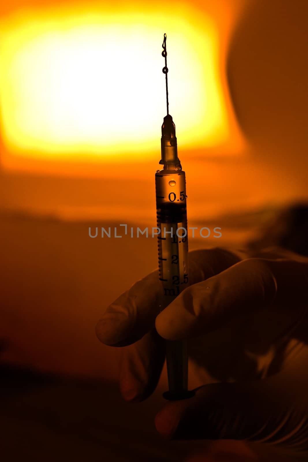 medical theme: syringe in yhe hands