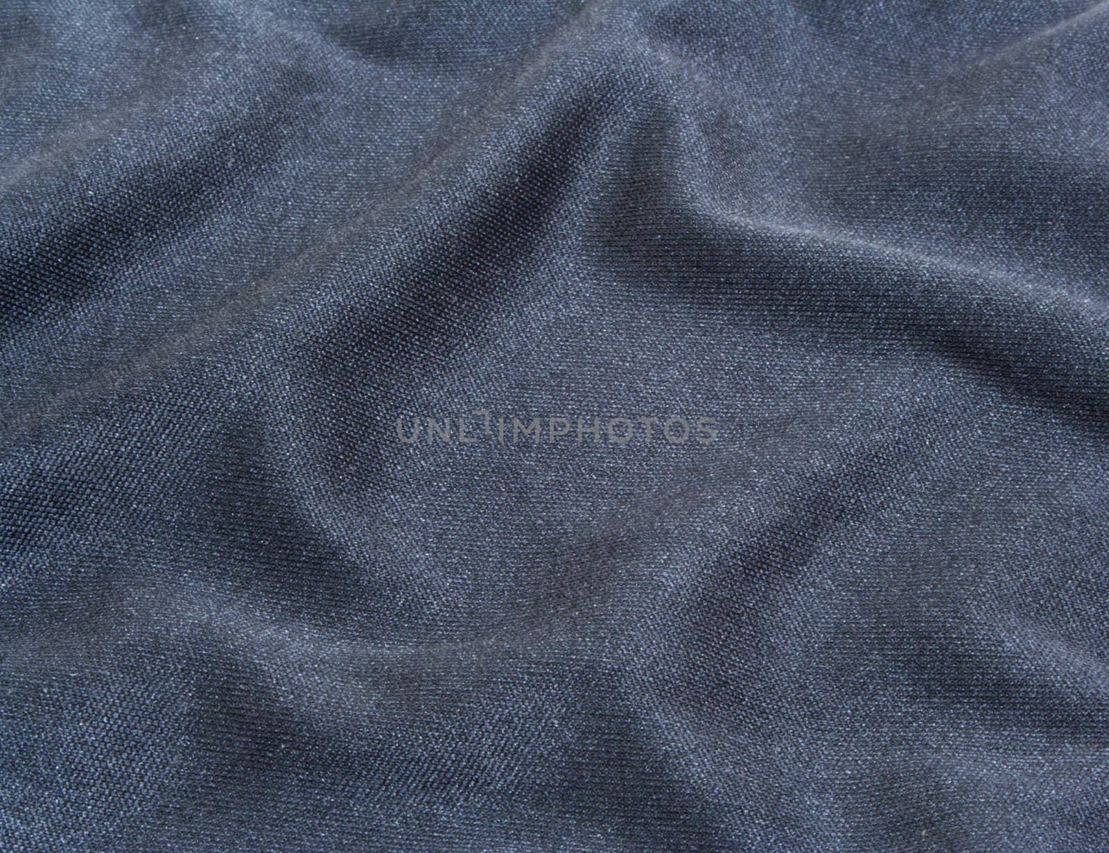 Wavy dark fabric.Abstract textured background. Close-up.