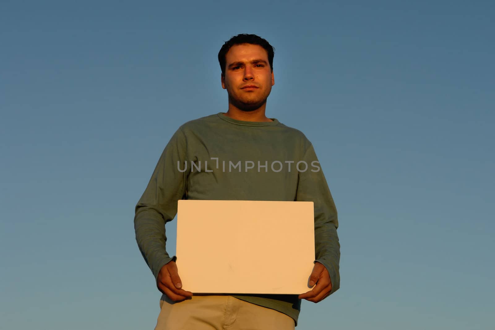 young man with an empty white card