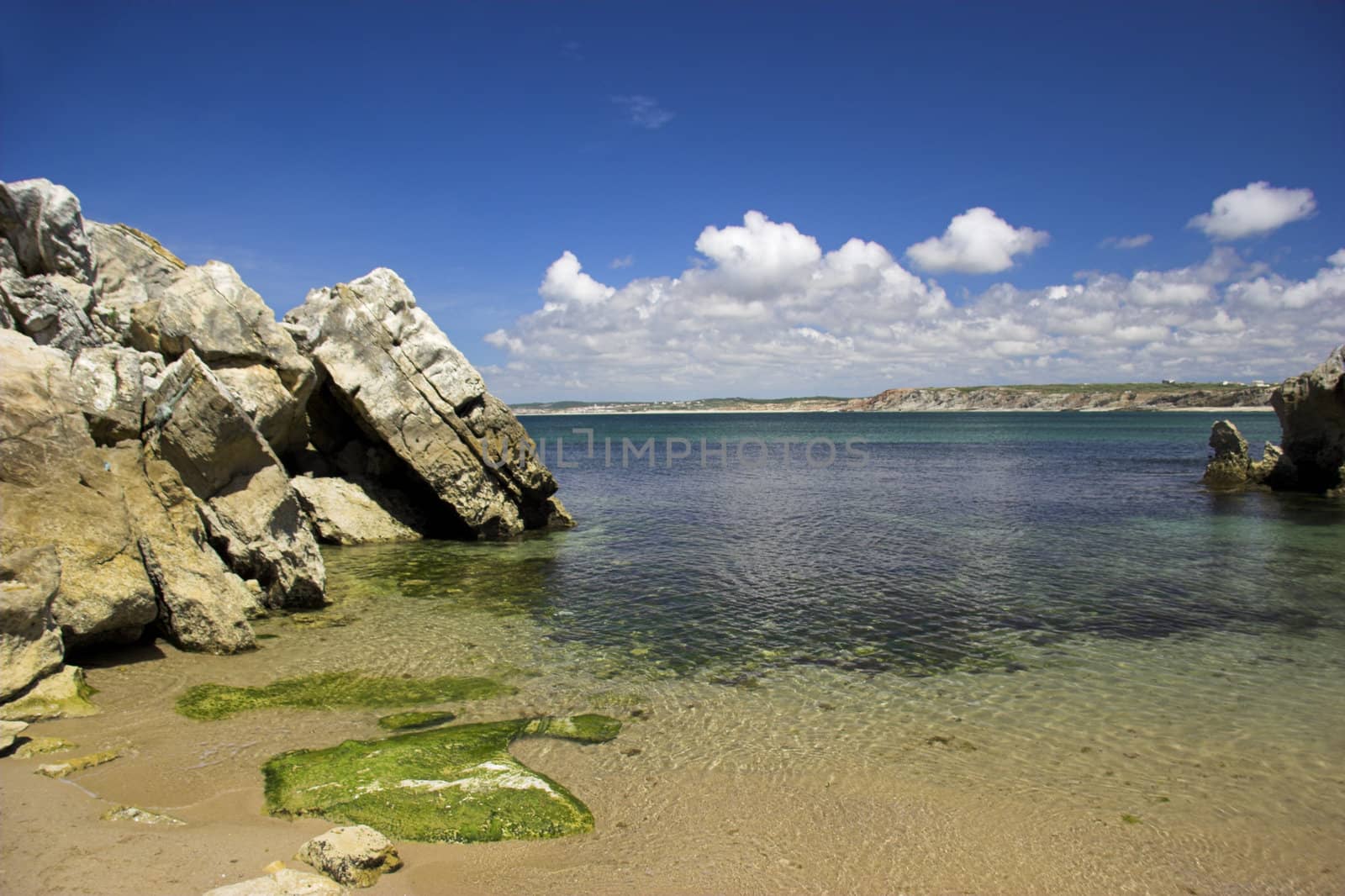 Beautiful blue beach with rocks and turquoise water