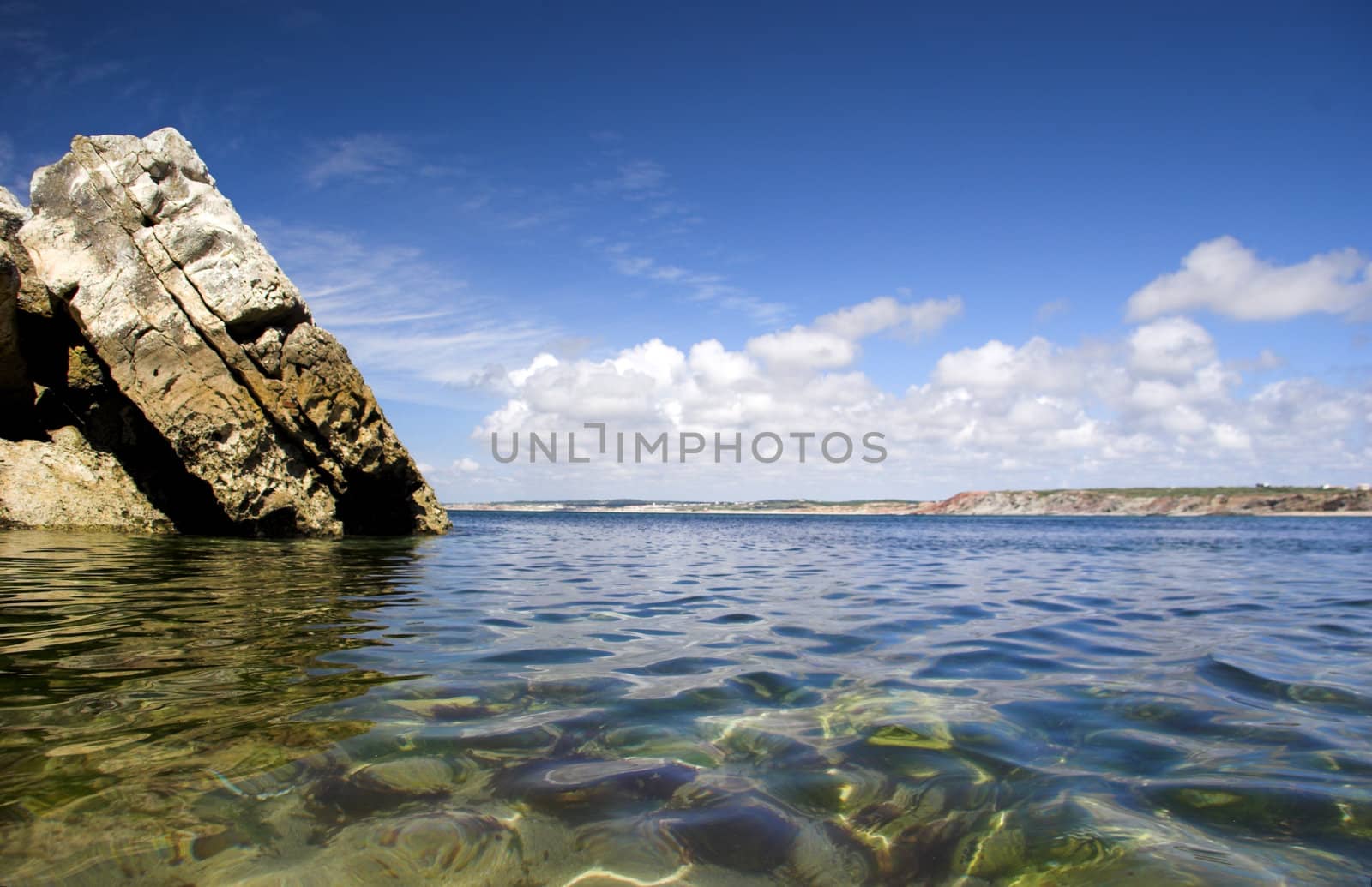 Beautiful blue beach with rocks and turquoise water