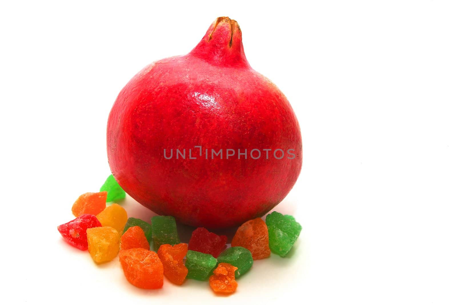 photo of the ripe pomegranate on white background