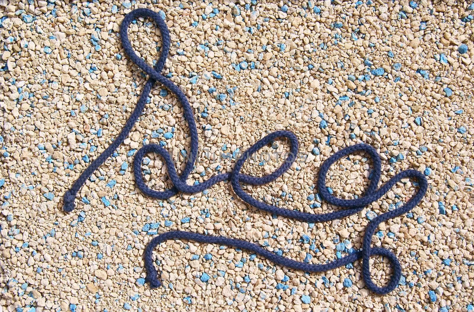 Dark-blue cord on the gold dust words sea