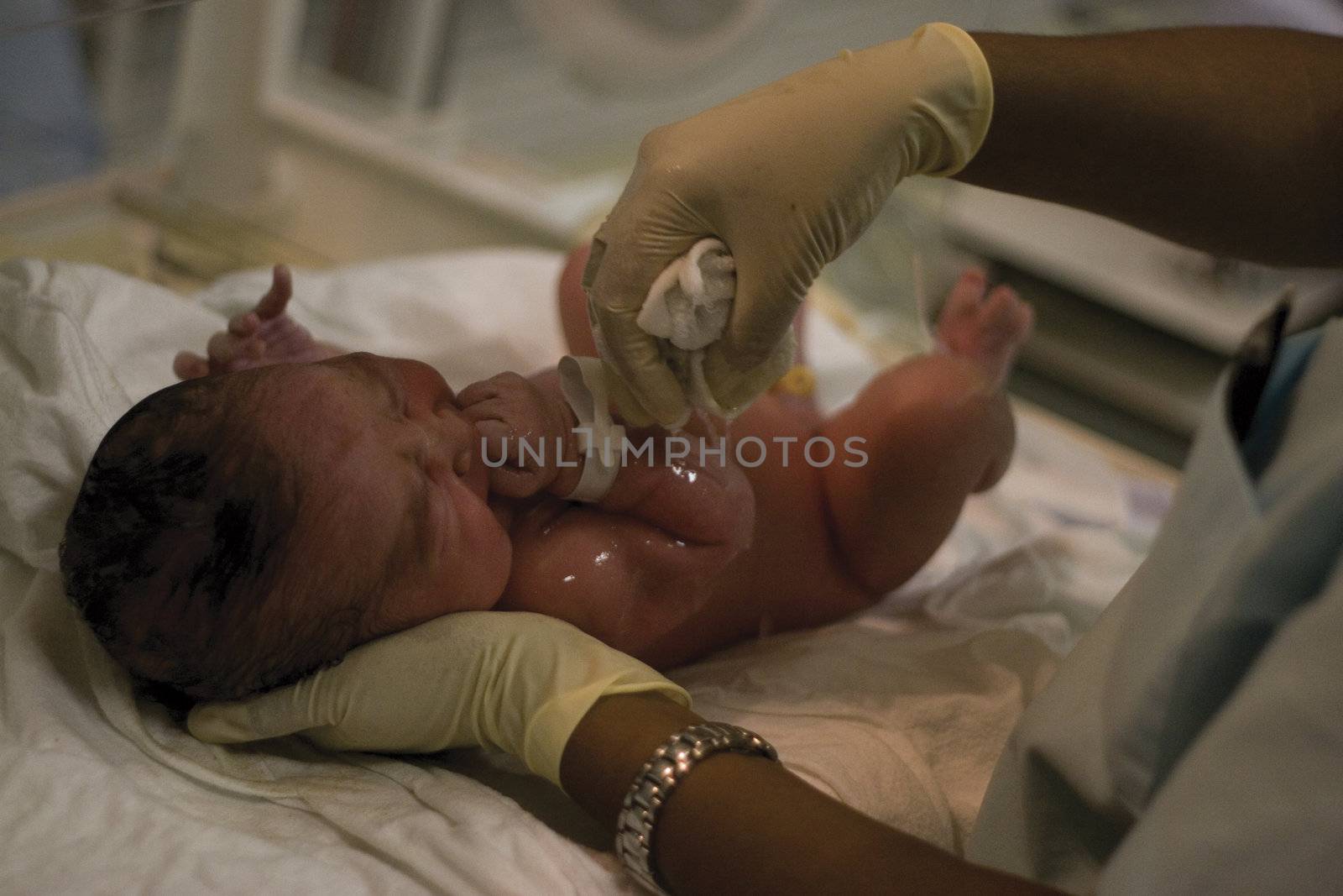 New born being taken care off by nurse