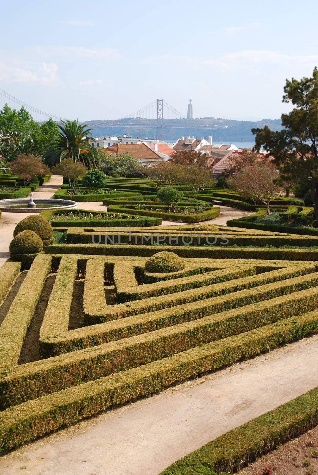 Enchanted Ajuda garden with April 25th bridge in Lisbon, Portugal by luissantos84
