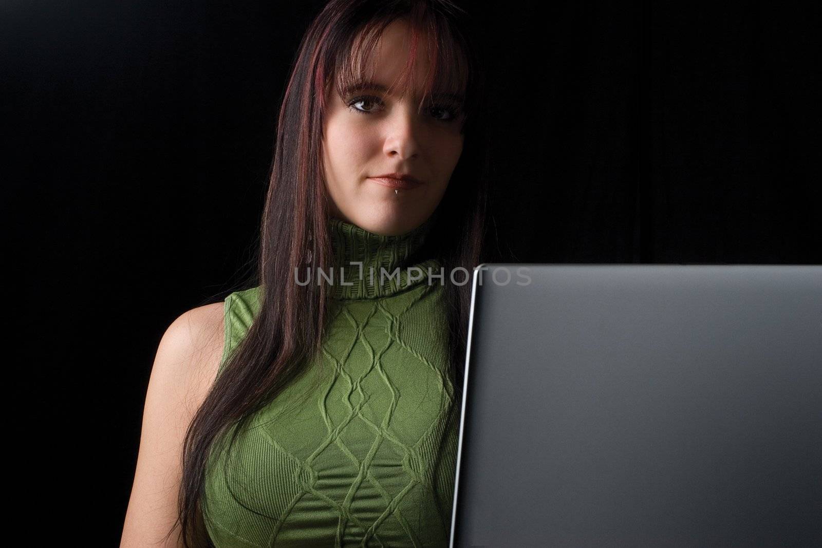 Twenty something fashion working on laptop while standing