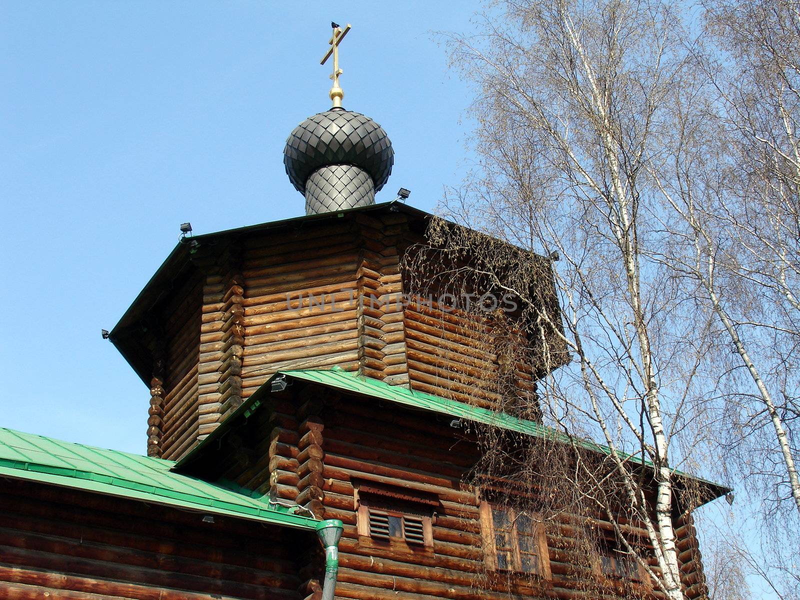 Russian wood orthodox church on a background of blue sky