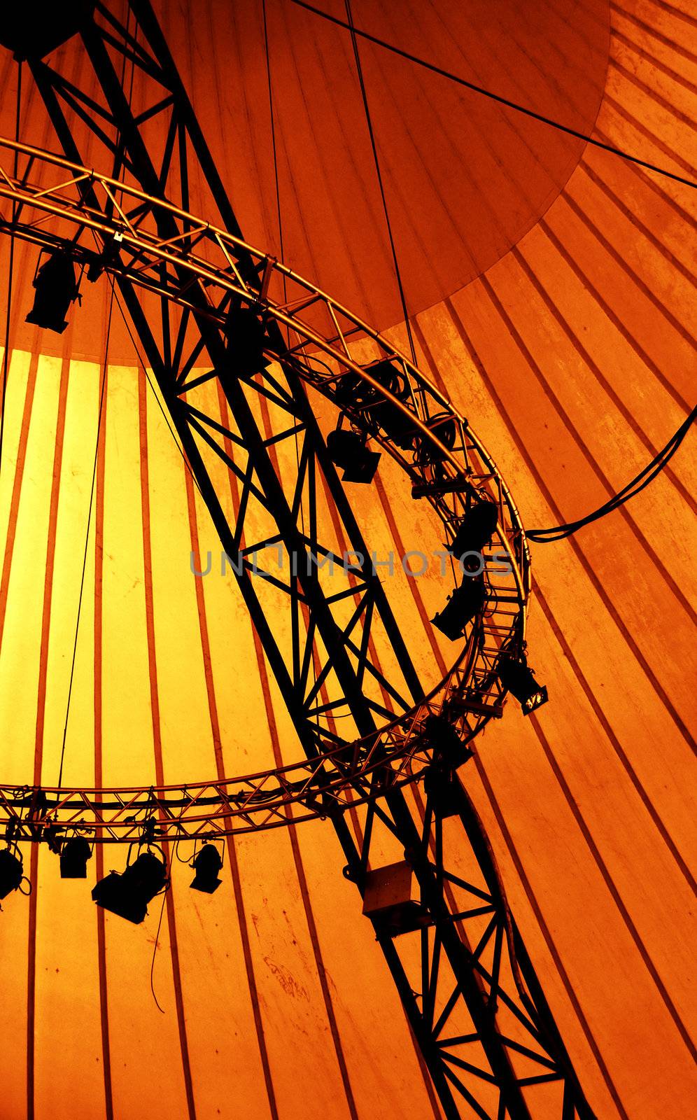 Black stage lights on orange background for outdoor performance