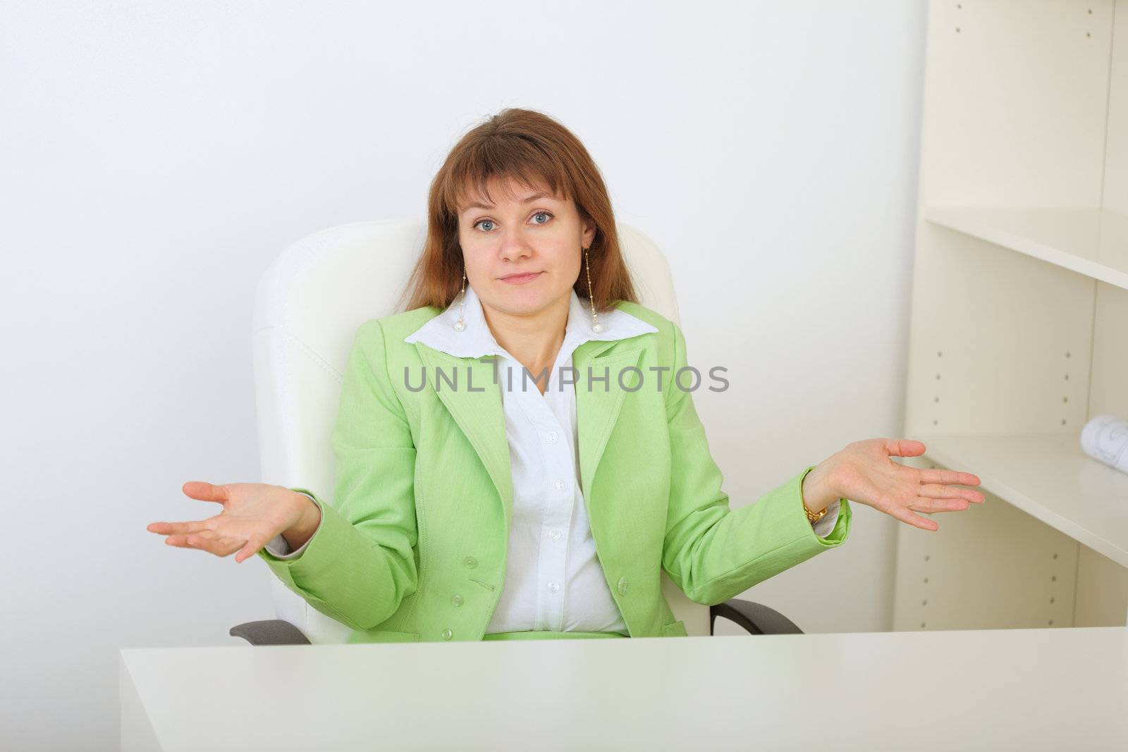 Surprised businesswoman shrugs by pzaxe