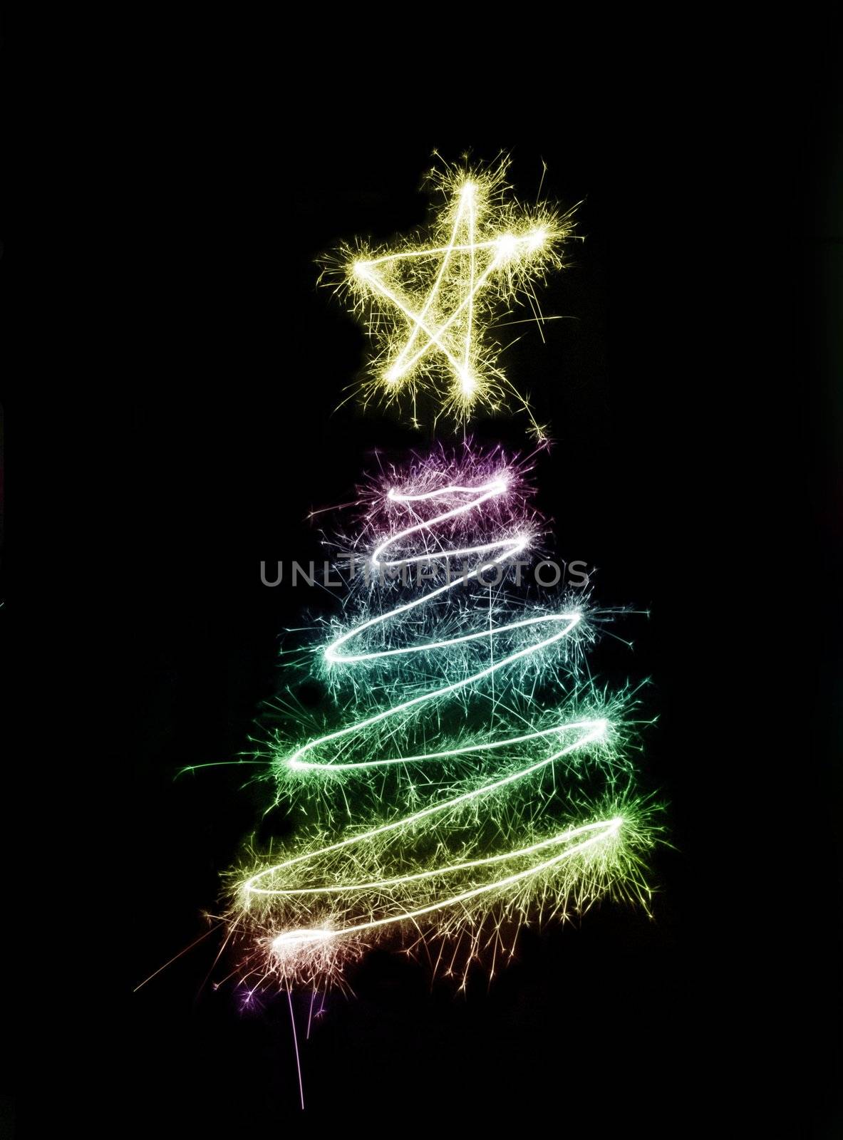 A colourful christmas tree symbol drawn in sparkler trails