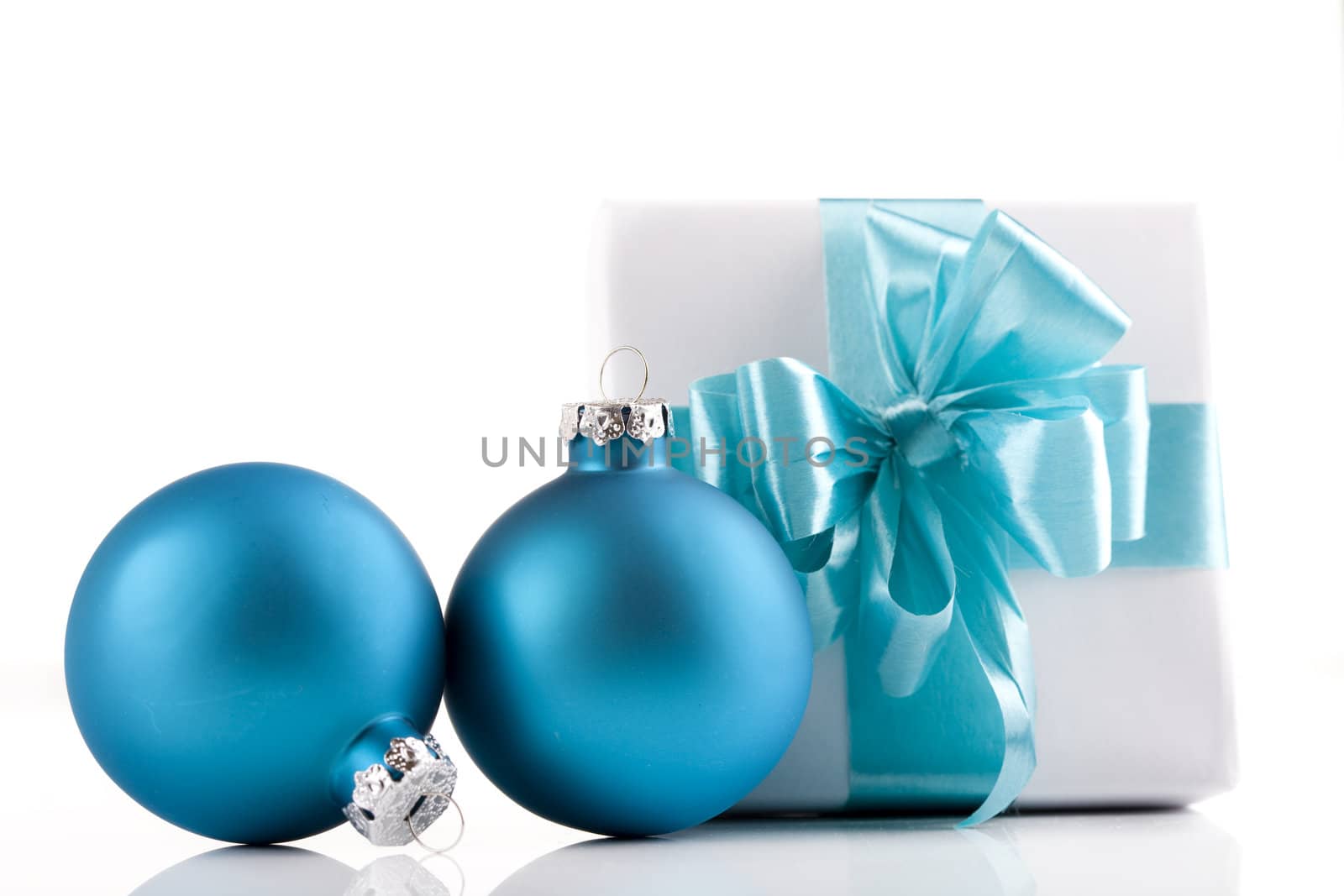 White present wrapped with sky blue ribbons and ornaments