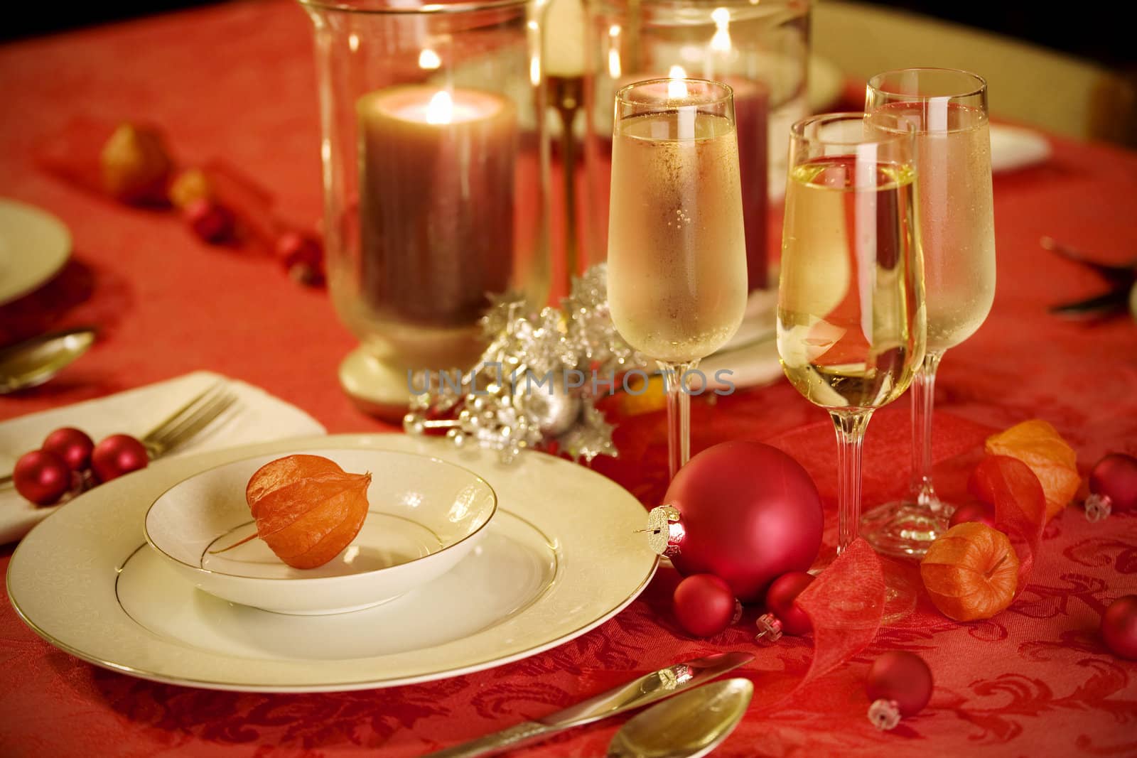 Elegant Christmas table setting in red and gold colors by jarenwicklund