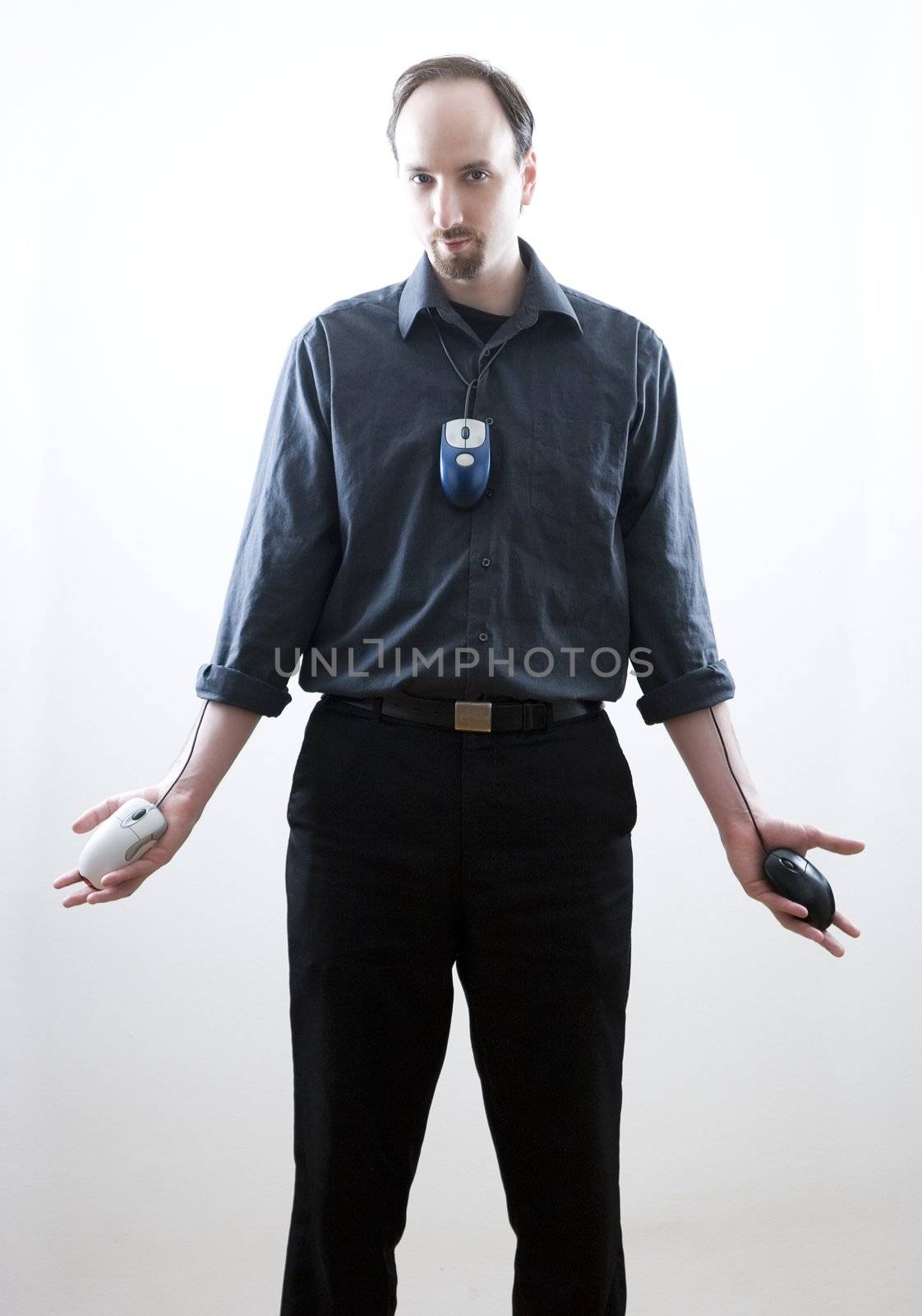 Thirty something man standing with open palms, call on some religious imagery.  Each palm has a mouse with the wires coming from inside the shirt.  A mouse is also worned as a tie