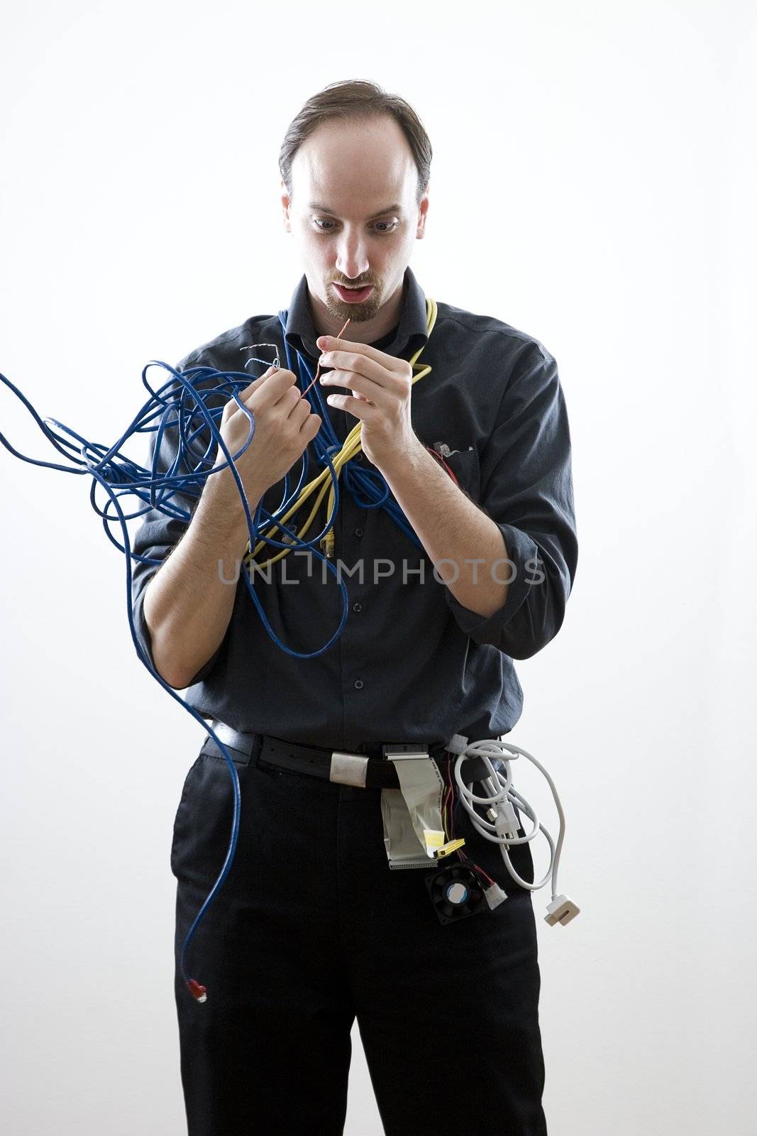 Dumb technician surprise by wires in his hand