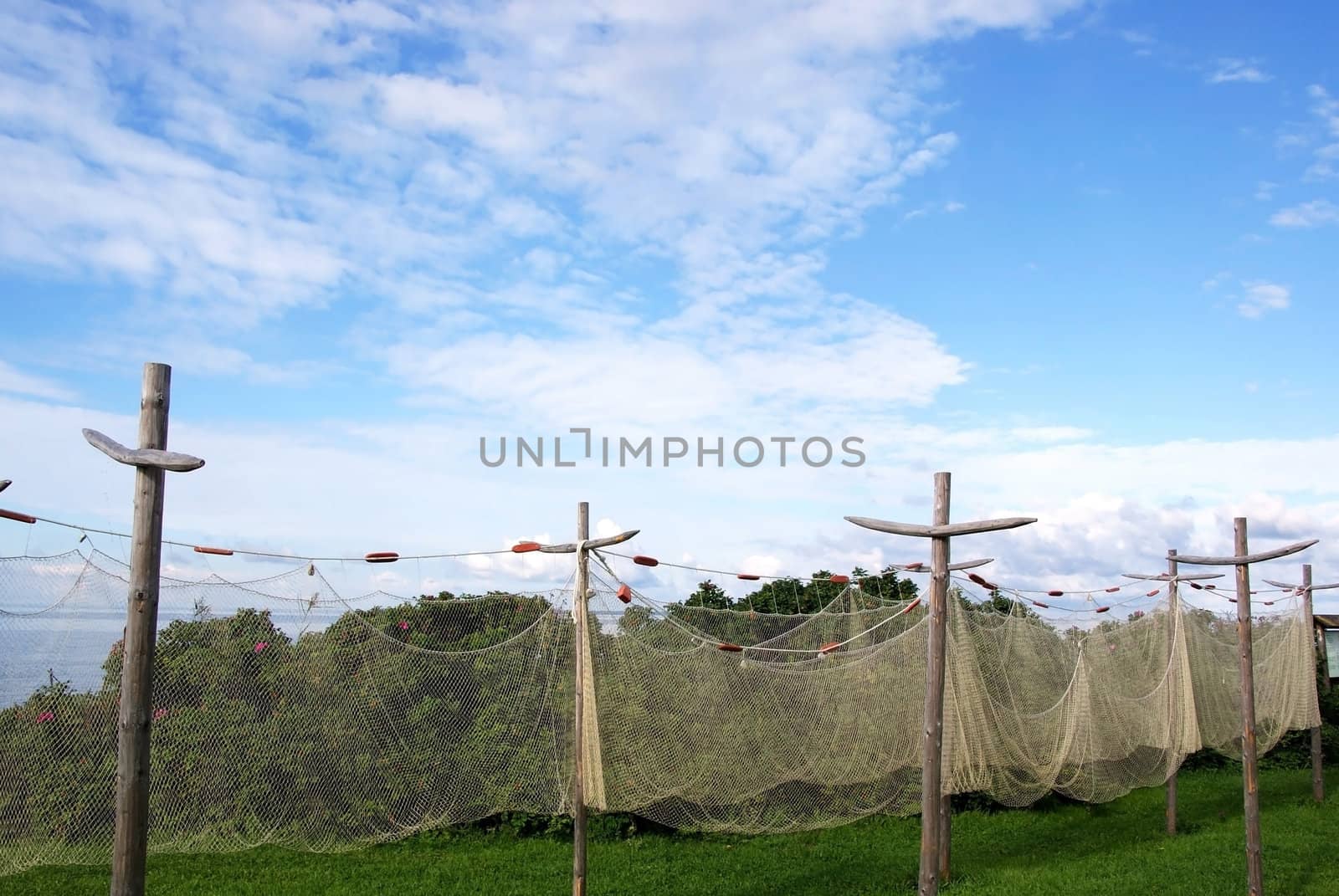 Fishing networks on a background of the blue sky and clouds