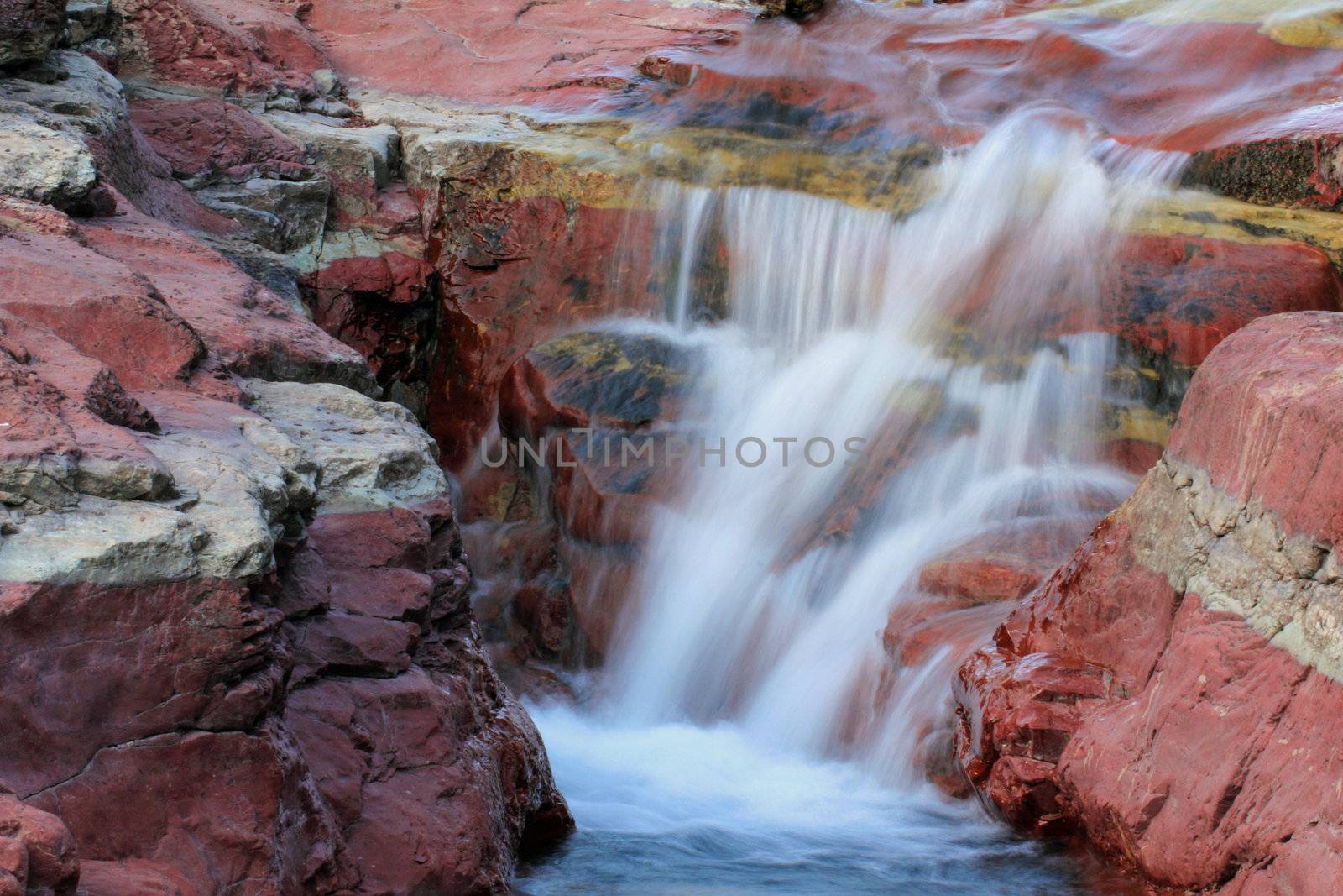 Waterfall and Red Rocks - Waterton lakes National Park by gonepaddling