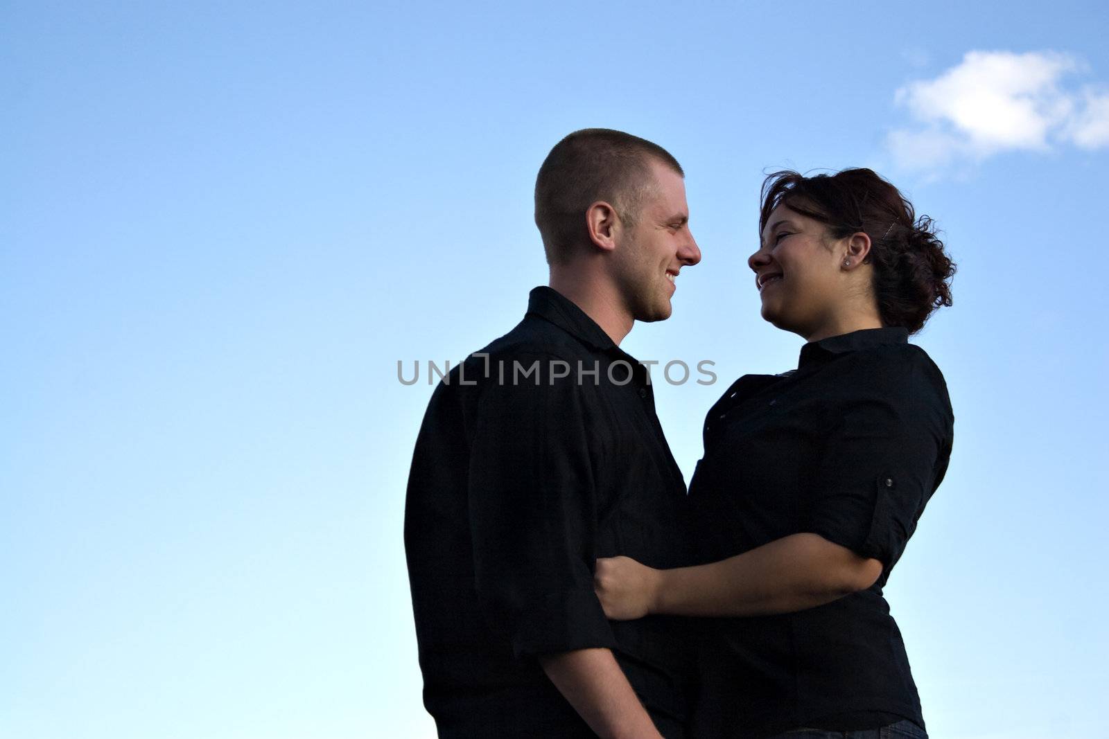 A young happy couple gazing into each others eyes.