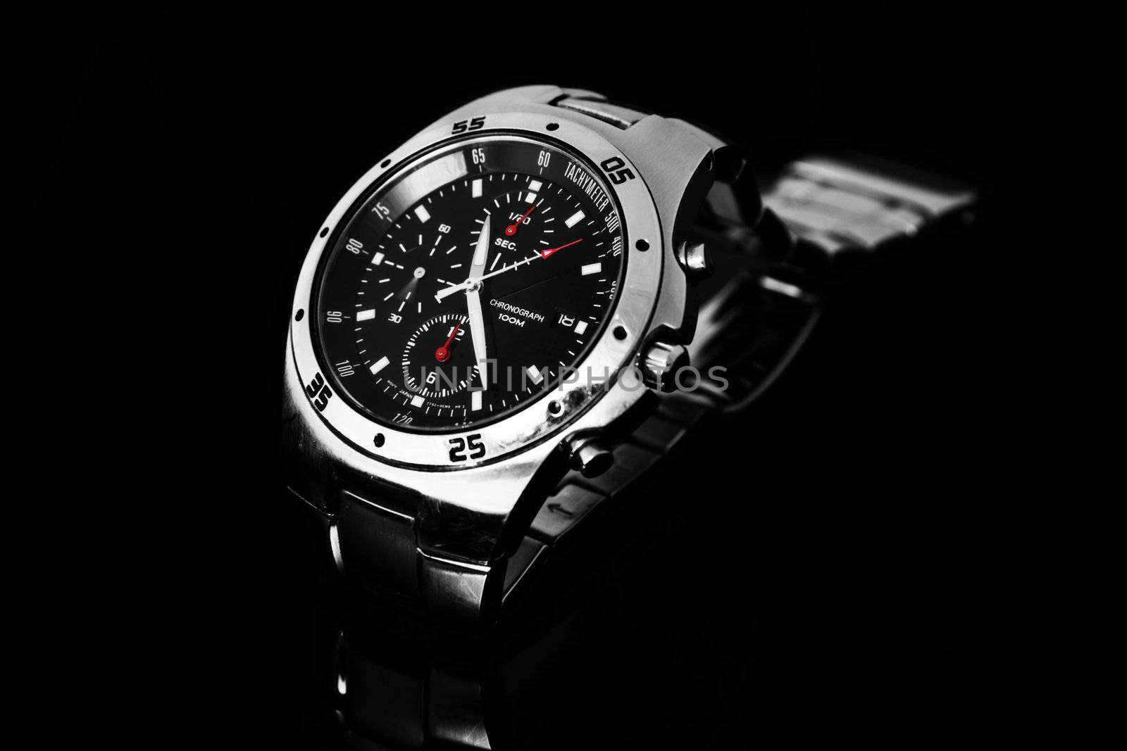 Men's watch on black by monkeystock