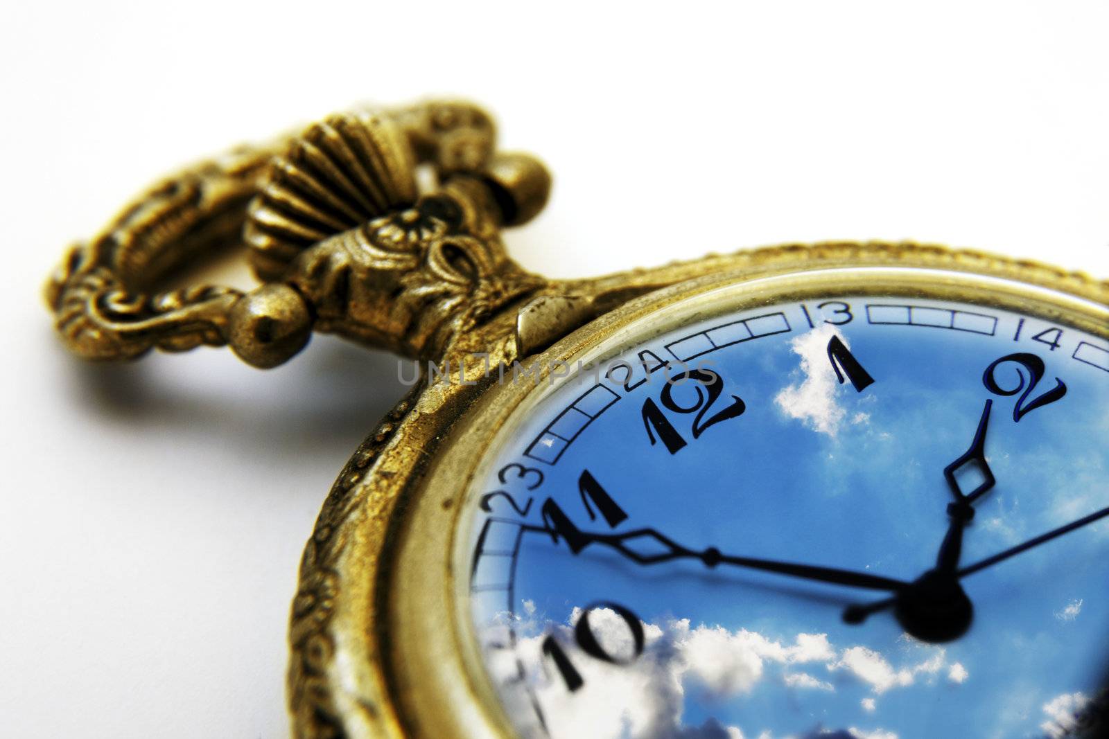 Gold pocket watch with the sky for a face