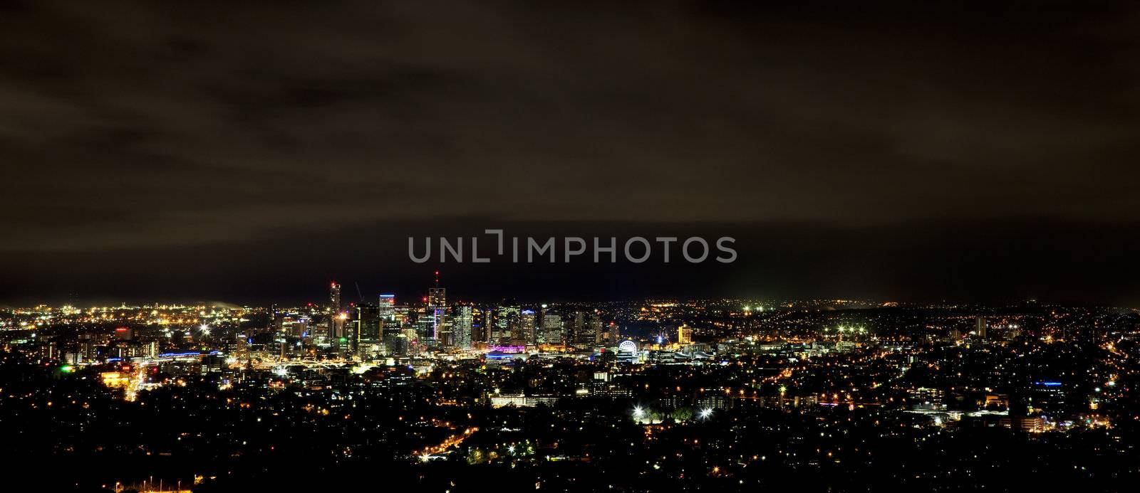 Wide panoramic shot of Brisbane on an overcast night