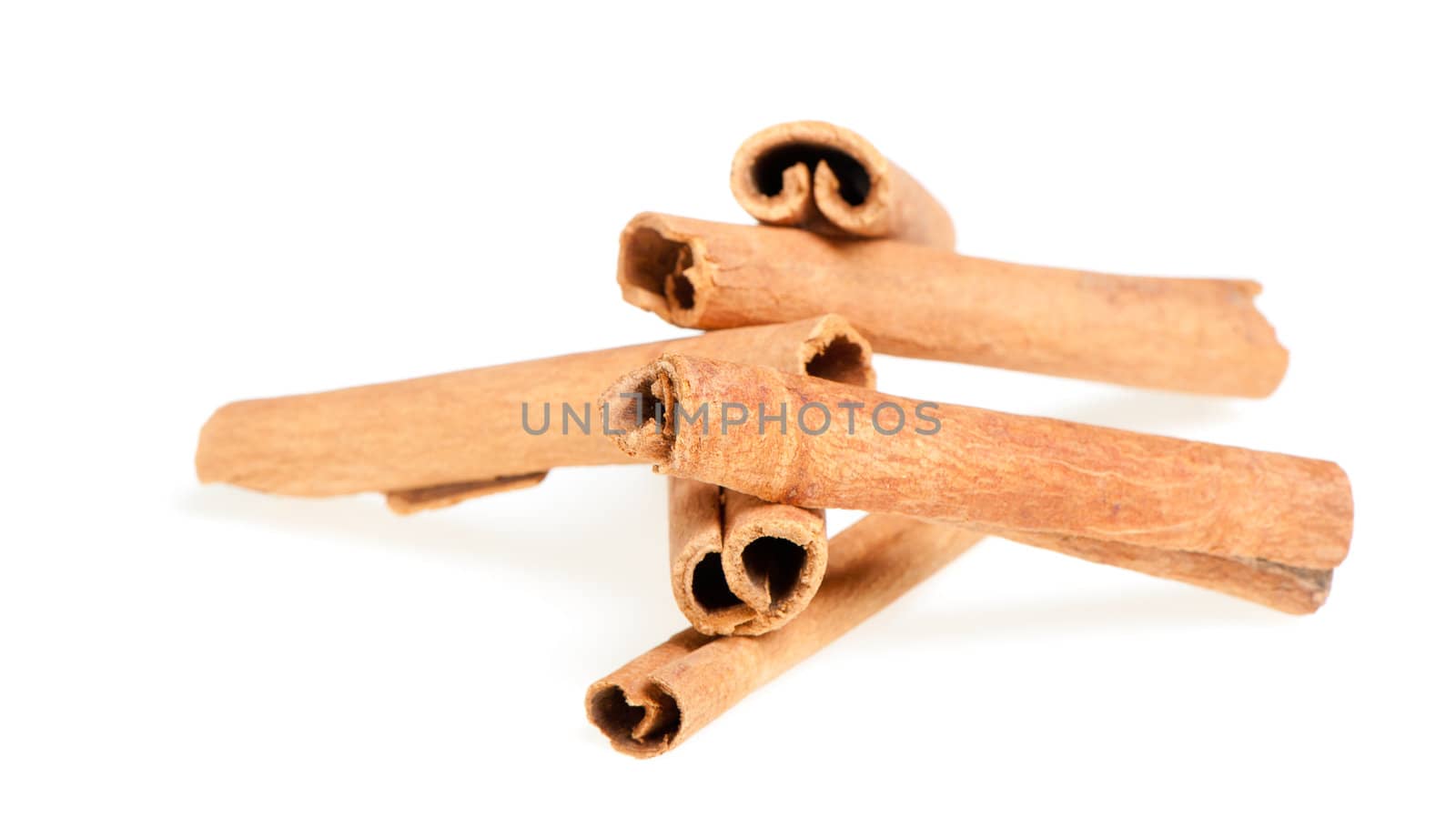 Cinnamon. A heap of sticks of cinnamon on a white background