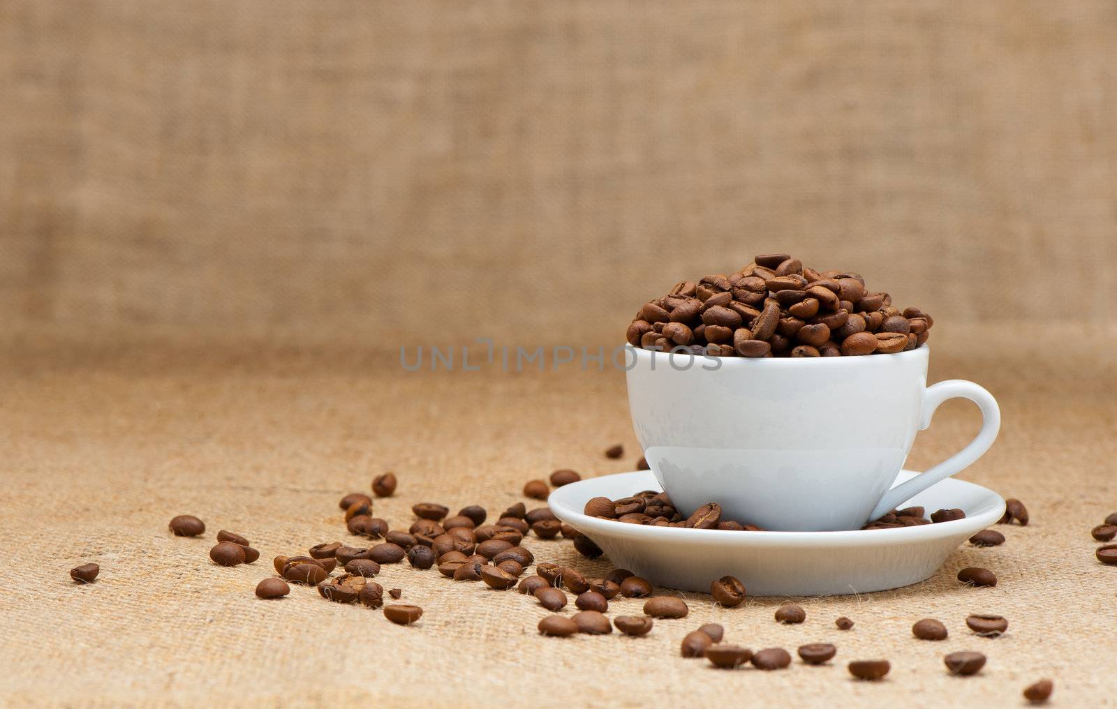White cup with coffee grains by galdzer
