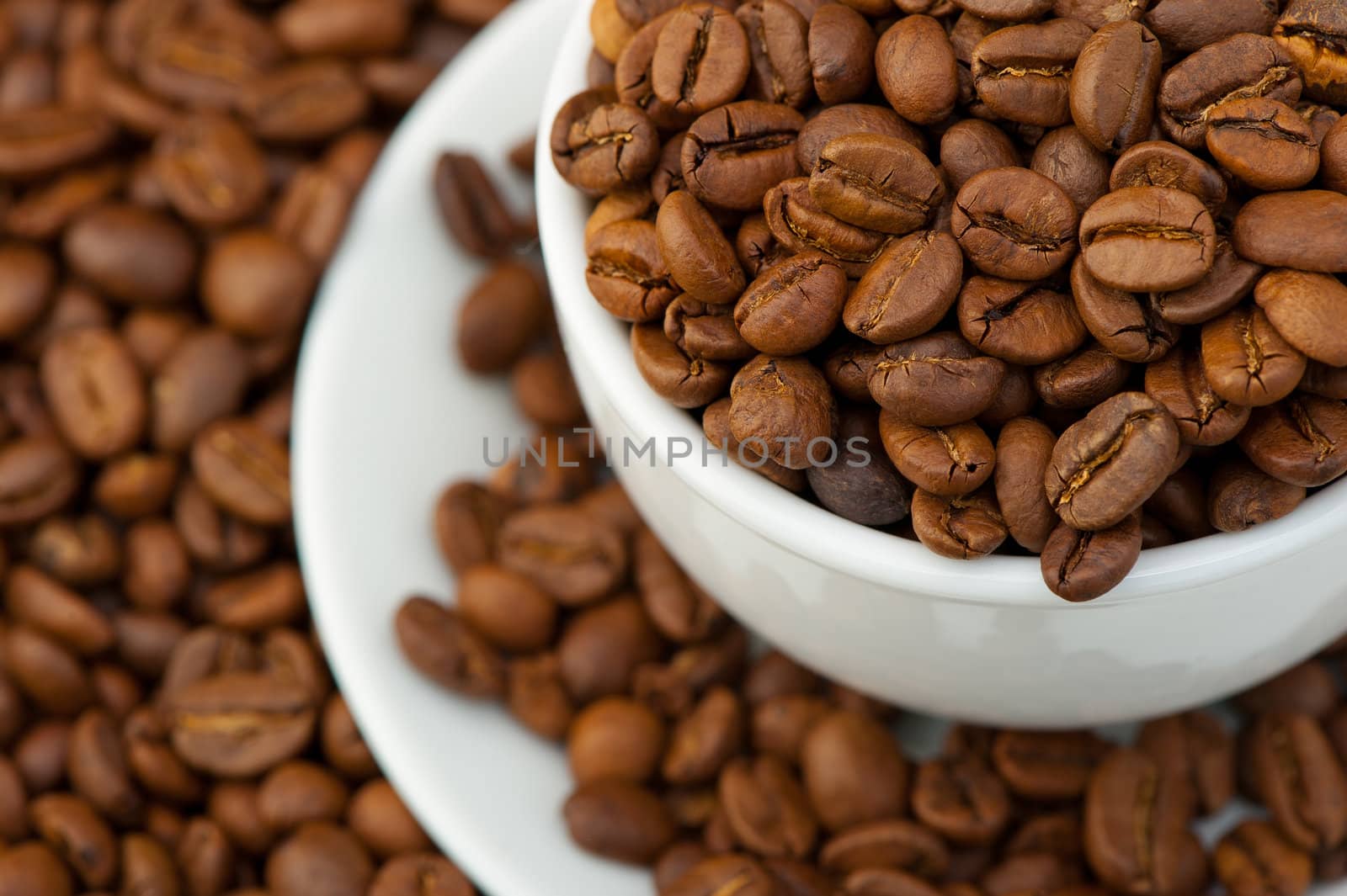 White cup with coffee grains. A photo close up